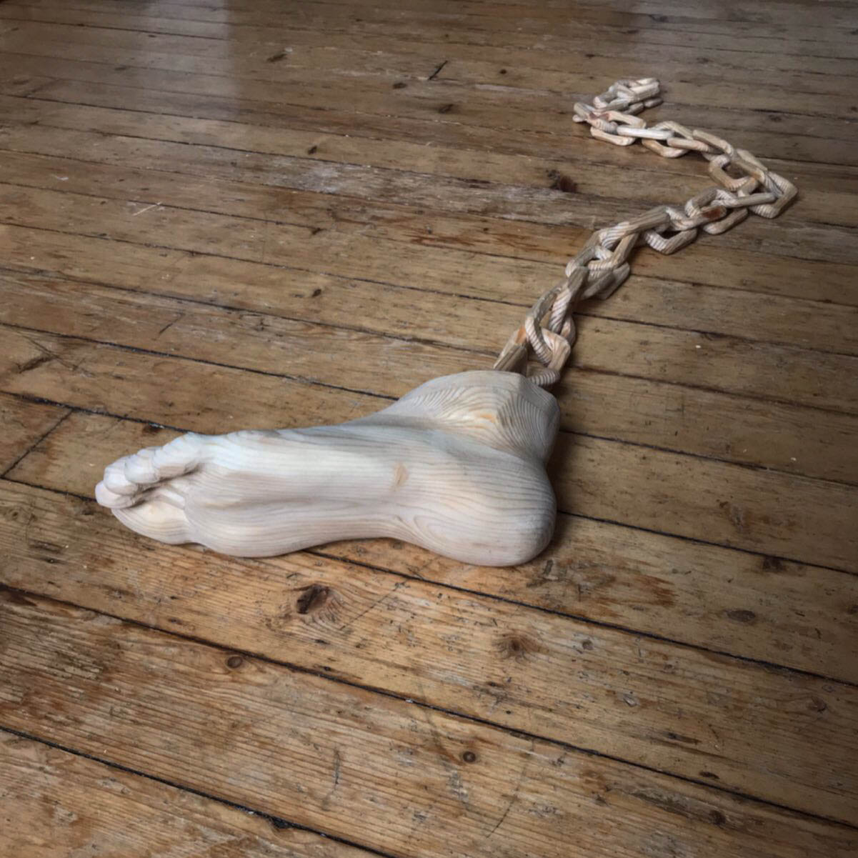 Untitled Foot with Chain carved during COVID-19 lockdown. [recycled industrial pine.] 