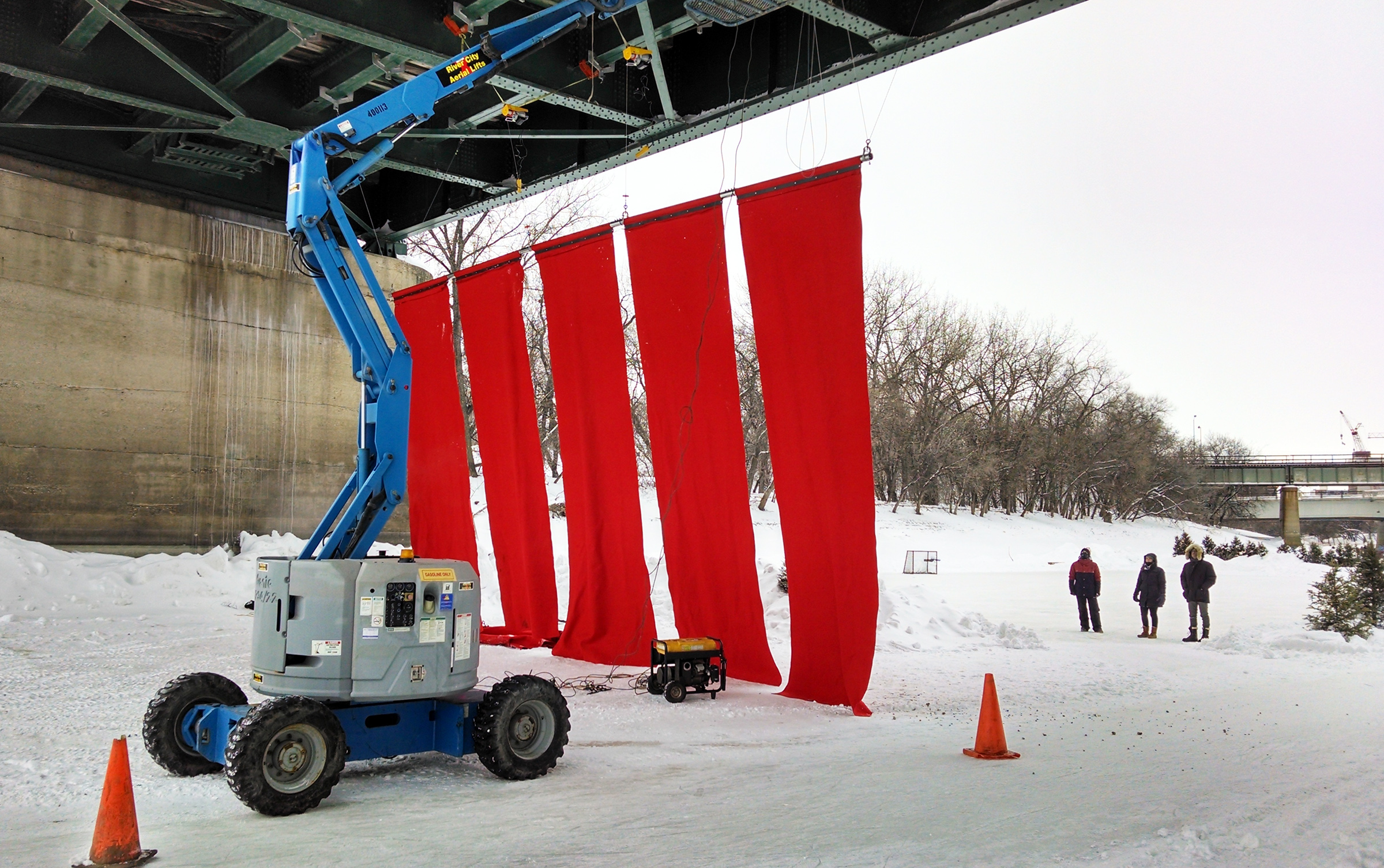 Red Blanket install with boom lift