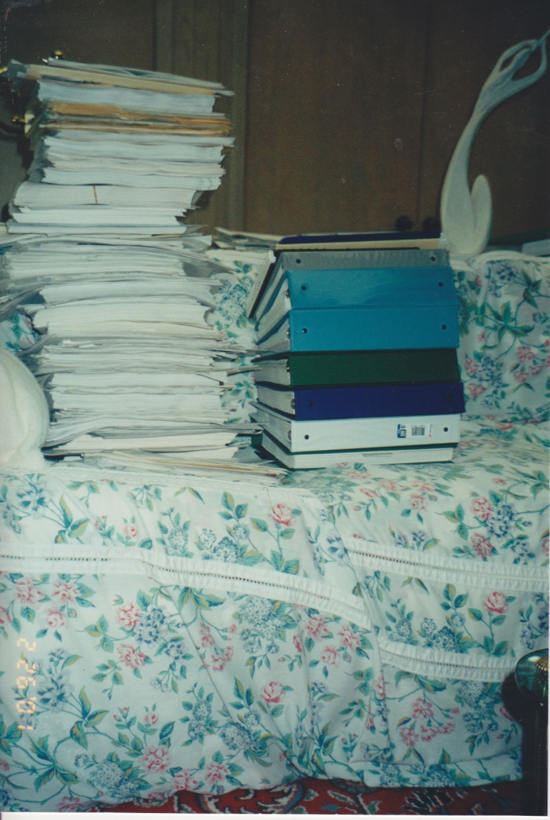 A later look at process: stacks of binders and folder, containing interview transcriptions, drafts, and other research papers. (2/26/2001)