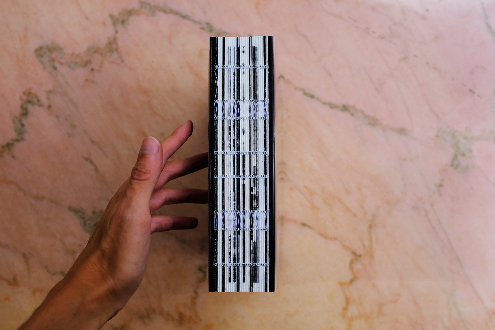 Philippe Sarfati-Territories-photography-photographer-street-documentary-architecture-black-and-white-book-design-arvinius-orfeus-kickstarter-cover-layout-white-page-pink-marble-naked-back-exposed-spine