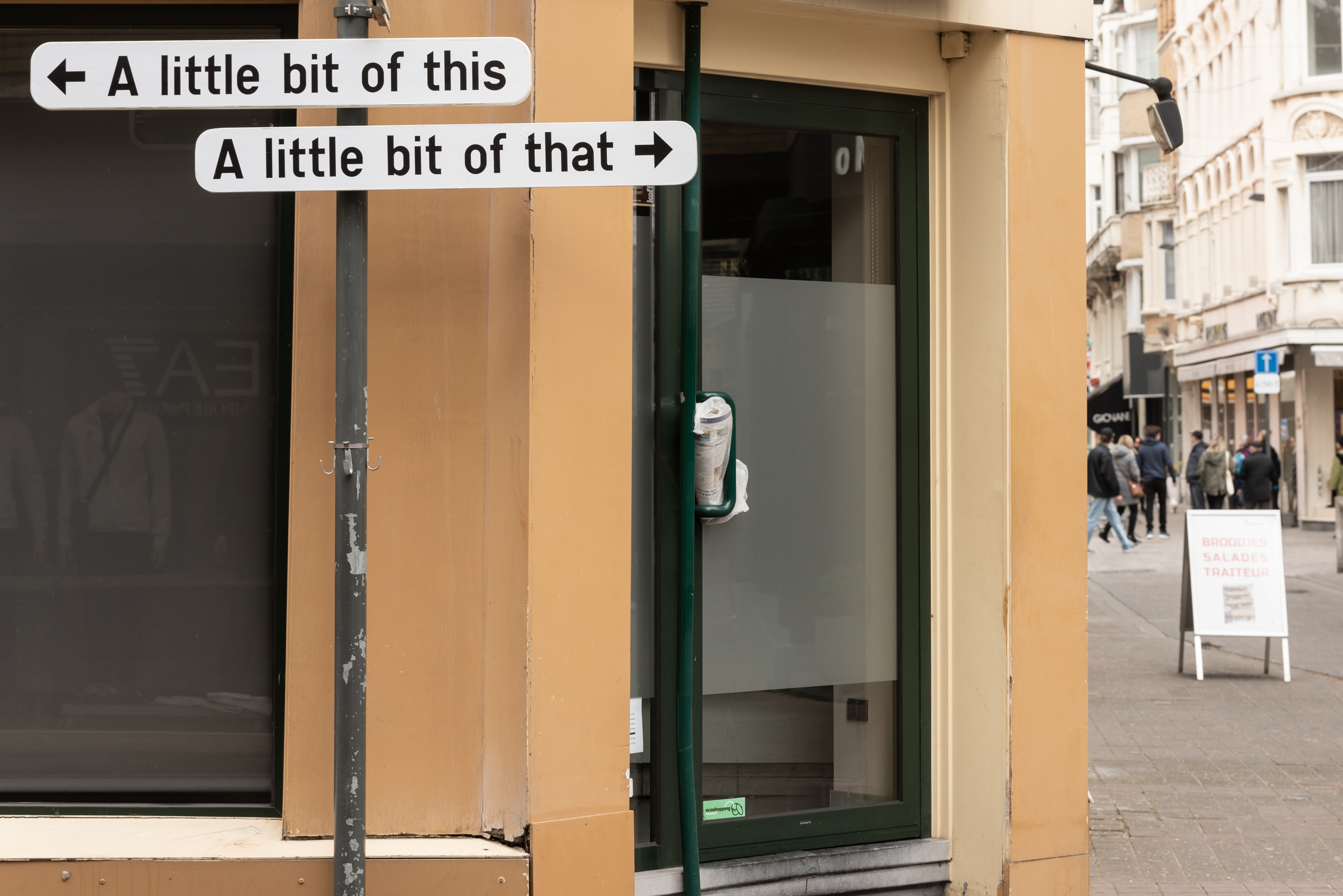 A little bit of this / A little bit of that. 2019Vinyl sticker on traffic signVariable dimensions