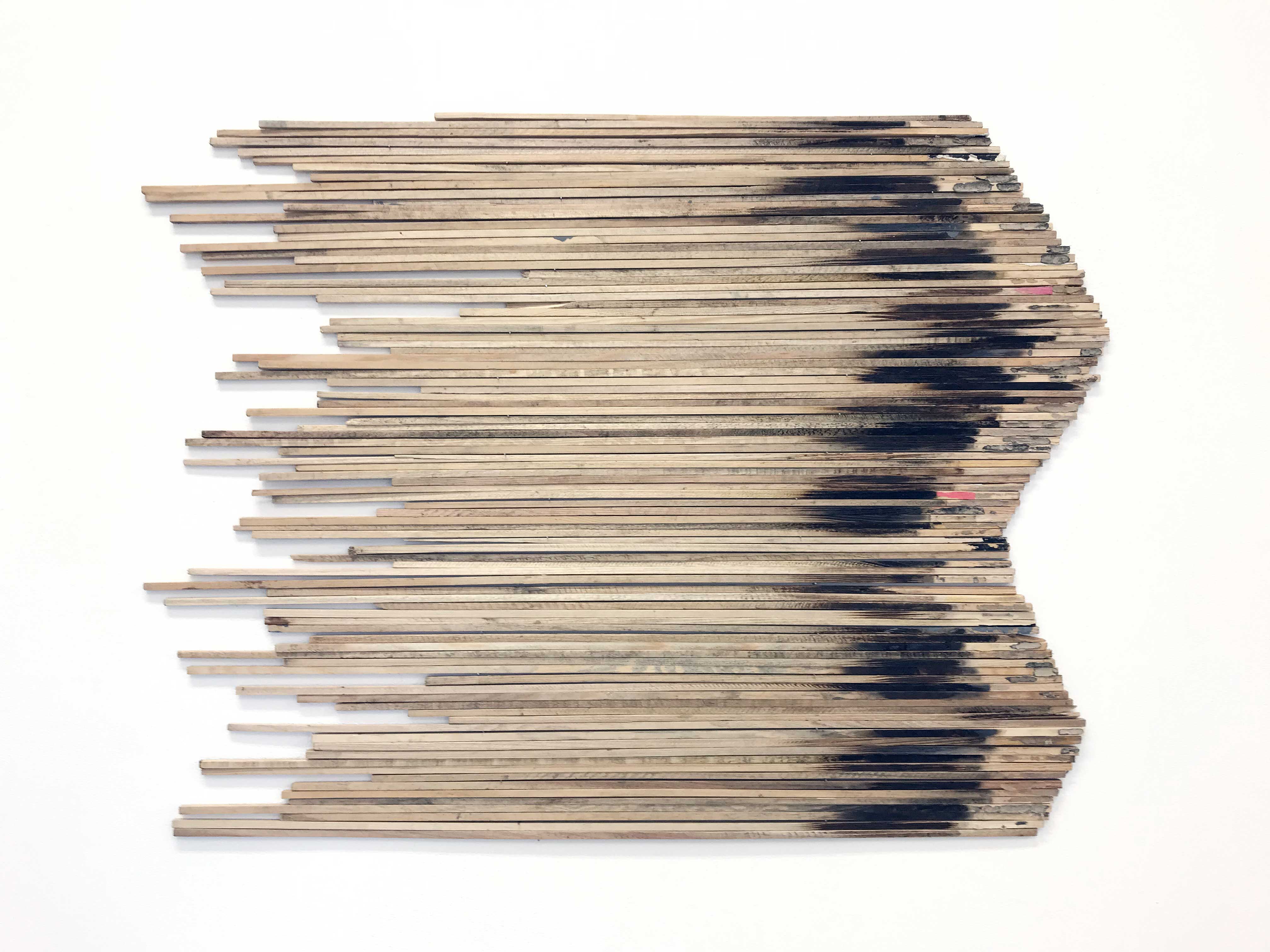 'Rocket', wall installation with wooden sticks from fireworks, dimension variable, solo show 'Here, I'm a river' at Molekyl Gallery, Malmö, 2023