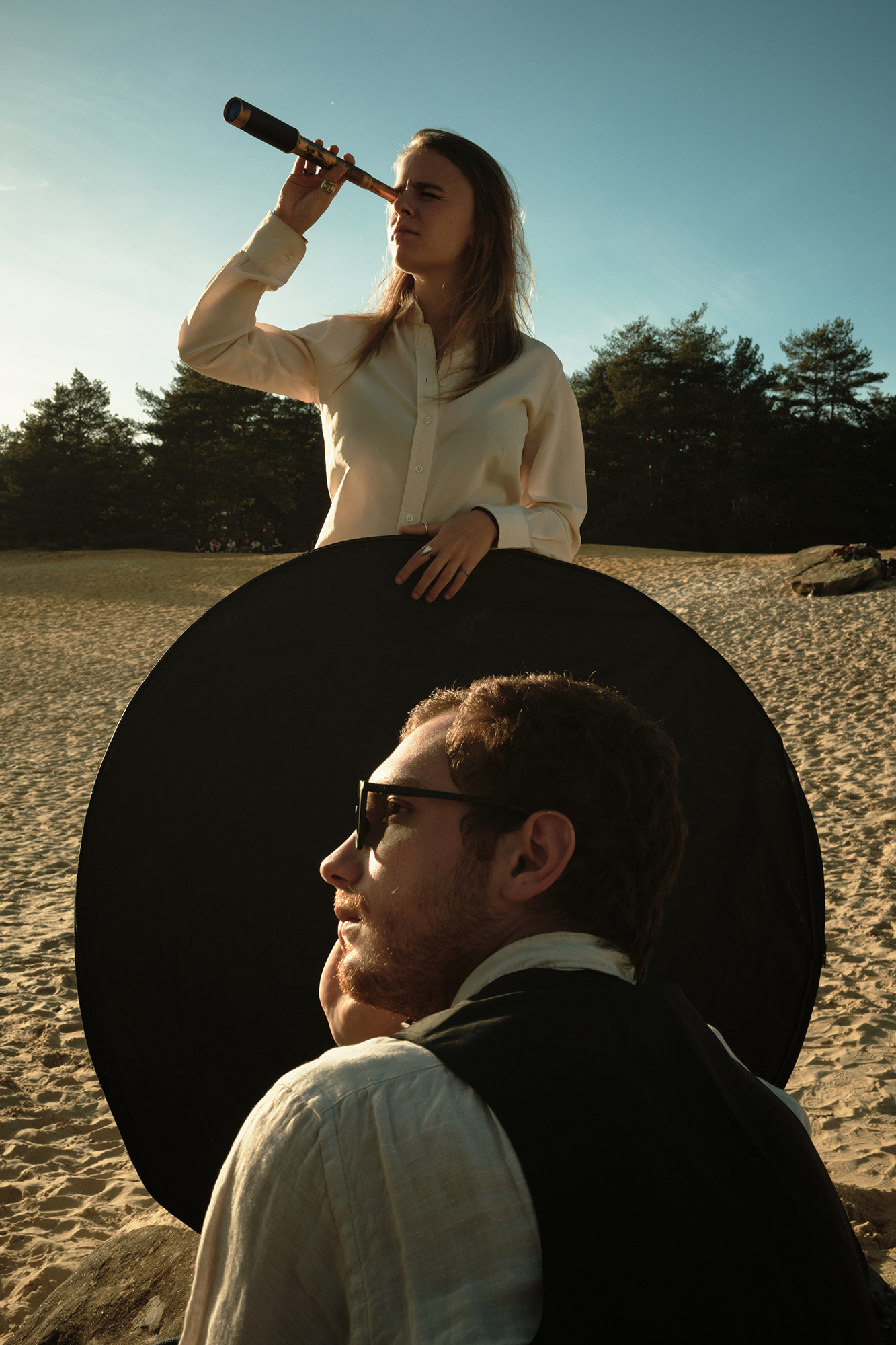 Philippe Sarfati-set photography-photographer-photography-street-documentary-music video-michael chereau-blindfold-at mos-france-portrait-absurd-black-circle-silhouette-spyglass-looking-sand-dunes-trees-forest-nature