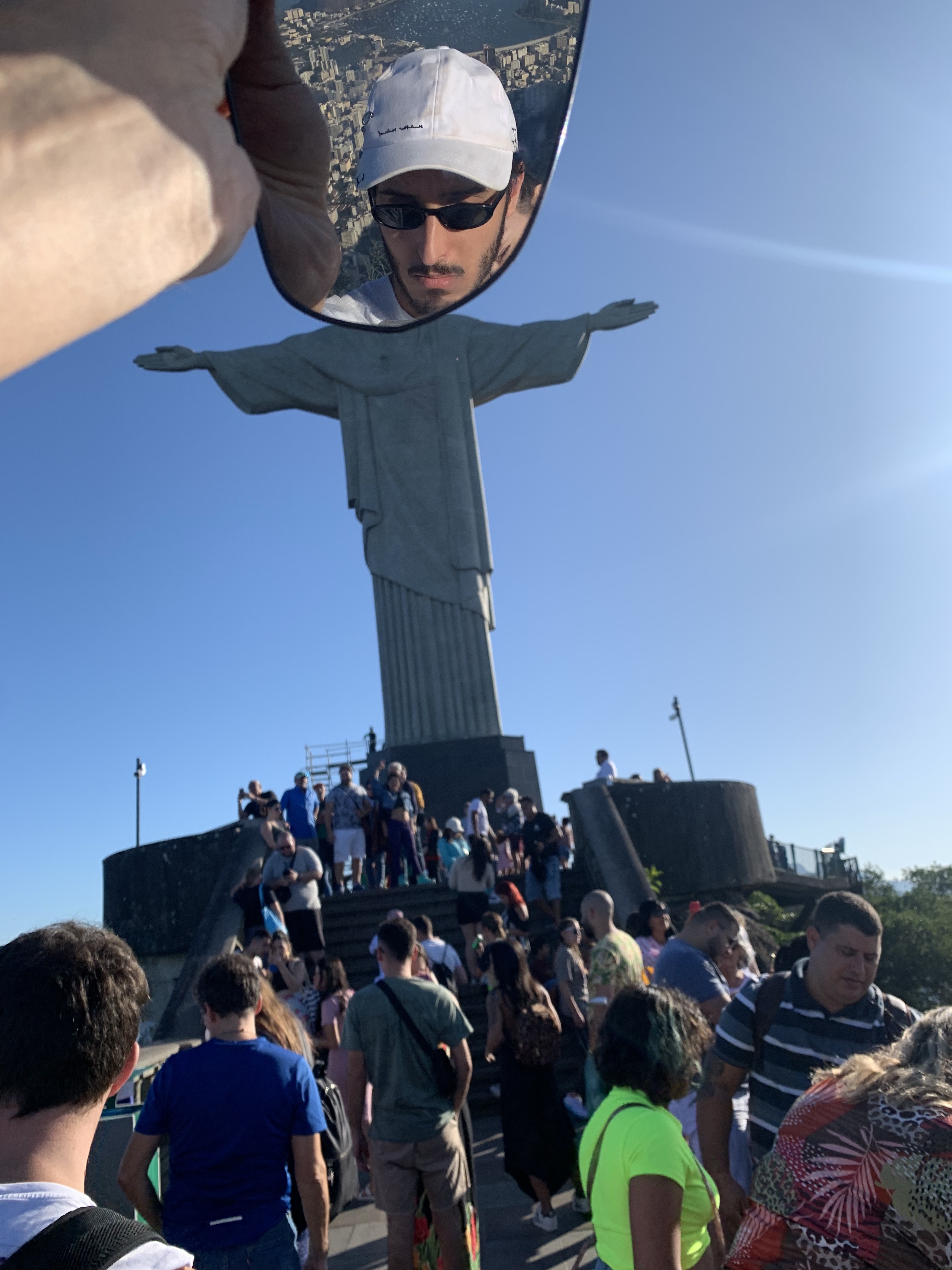 Found rearview mirror (self portrait as Christ the Redeemer), 2022, with Polina Shklovskaya