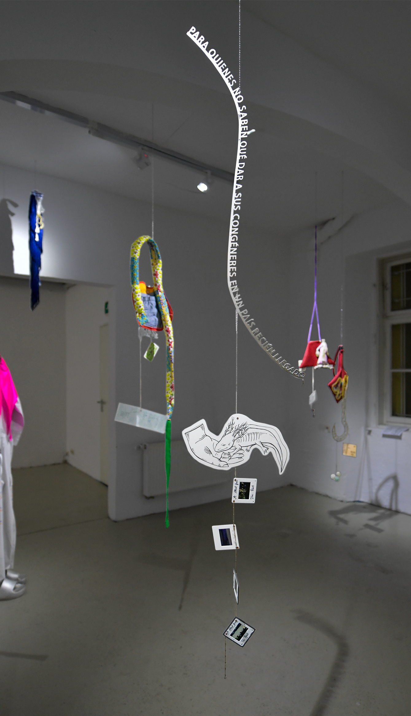 Objects in the foreground: Ksenia Bykovsky_Axolotl; Franziska Windolf with a quote paraphrasing Juvenal Morales Flores_'To those, who don't know what to give in a new place.'; Nicolas Wannenmacher_Blast From The Past. Image: Tom Hauzenberger.