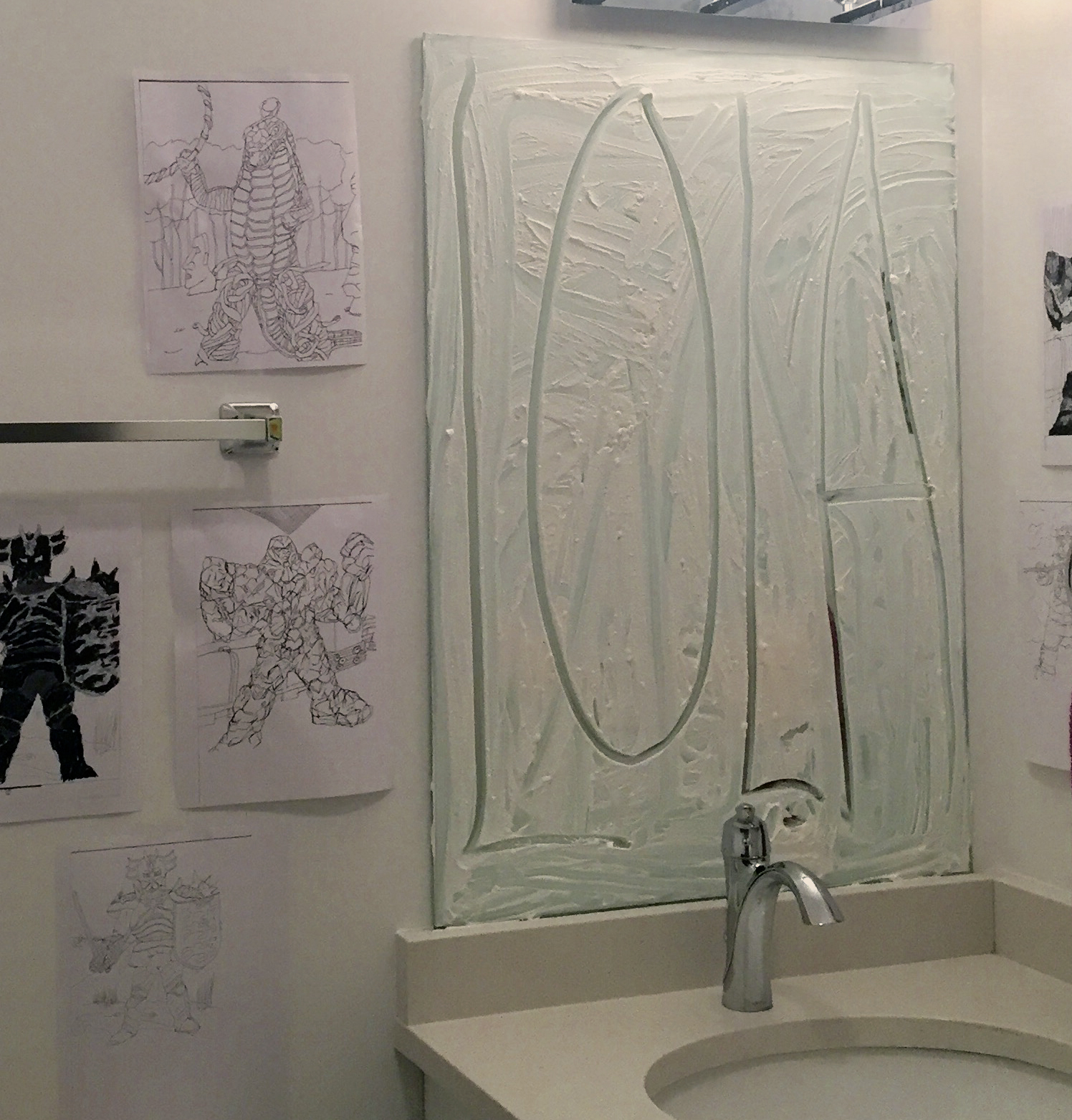 2/3 — LUKA. LOLA. POLLY.  For this project, Luka. Lola. Polly., along with its distinctive smell, the Noxzema face cream on beveled bathroom mirror has hand-written text of names taken from popular songs where the individual referenced has in some way been a victim of abuse or transgression ("Luka" by Susan Vega; "Lola" by the Kinks; "Polly" by Nirvana). The mirrors' surfaces are rendered dysfunctional, except for the small pieces of its surface exposed within each name's form. Site-responsive installation created for the inaugural exhibition Corporate Lunch at the Condo Association in Chicago, IL, 2017.