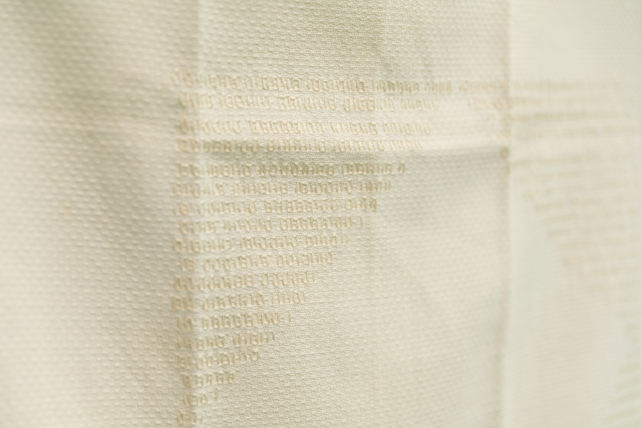 'Little Stabs.' Kris Blackmore, 2022. Encoded instructions for self-managed abortion embroidered on an antique tea towel. 31 x 17 in.