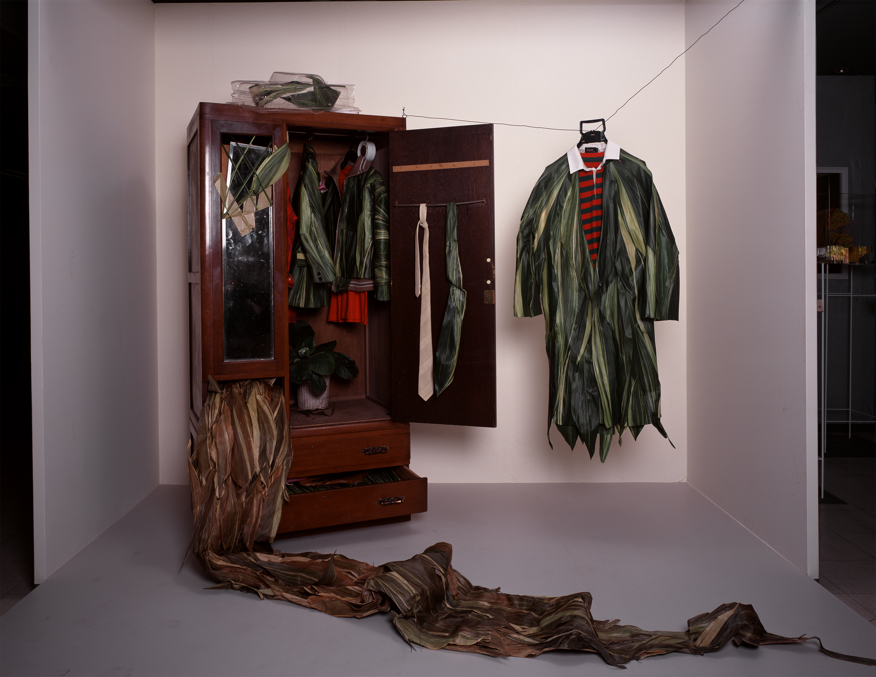 Untitled (Wardrobe), October 1996, New Zealand flax, various garments, wire, wooden wardrobe, clothing hangers, radio-controlled car plastic cover. Inkjet print, 17 x 22 in. (43.2 x 55.9 cm.). Photographer: Koichi Taniguchi.
