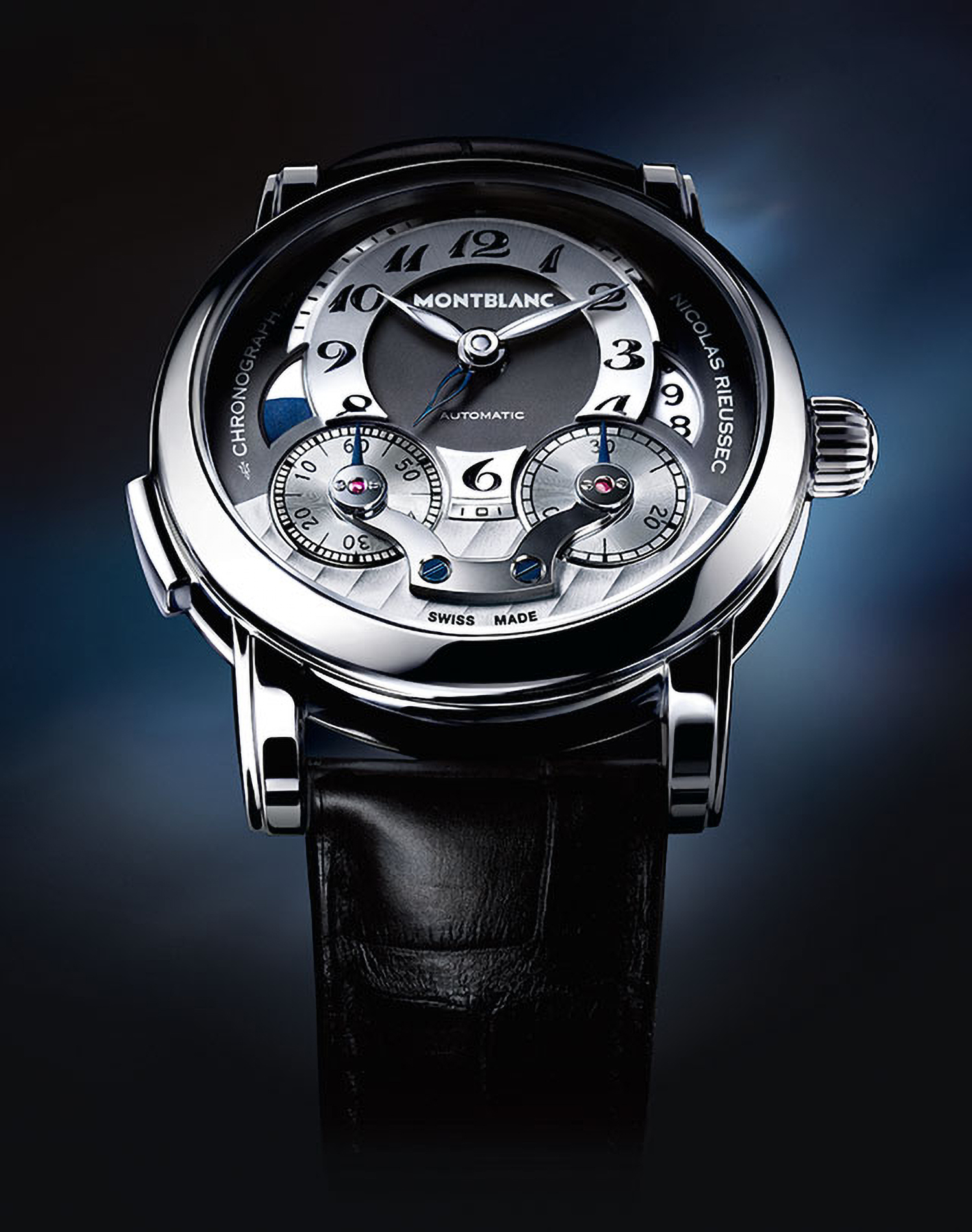 KMA photographer Daniel Schweizer photographs silver and black watch against a navy blue background for Montblanc
