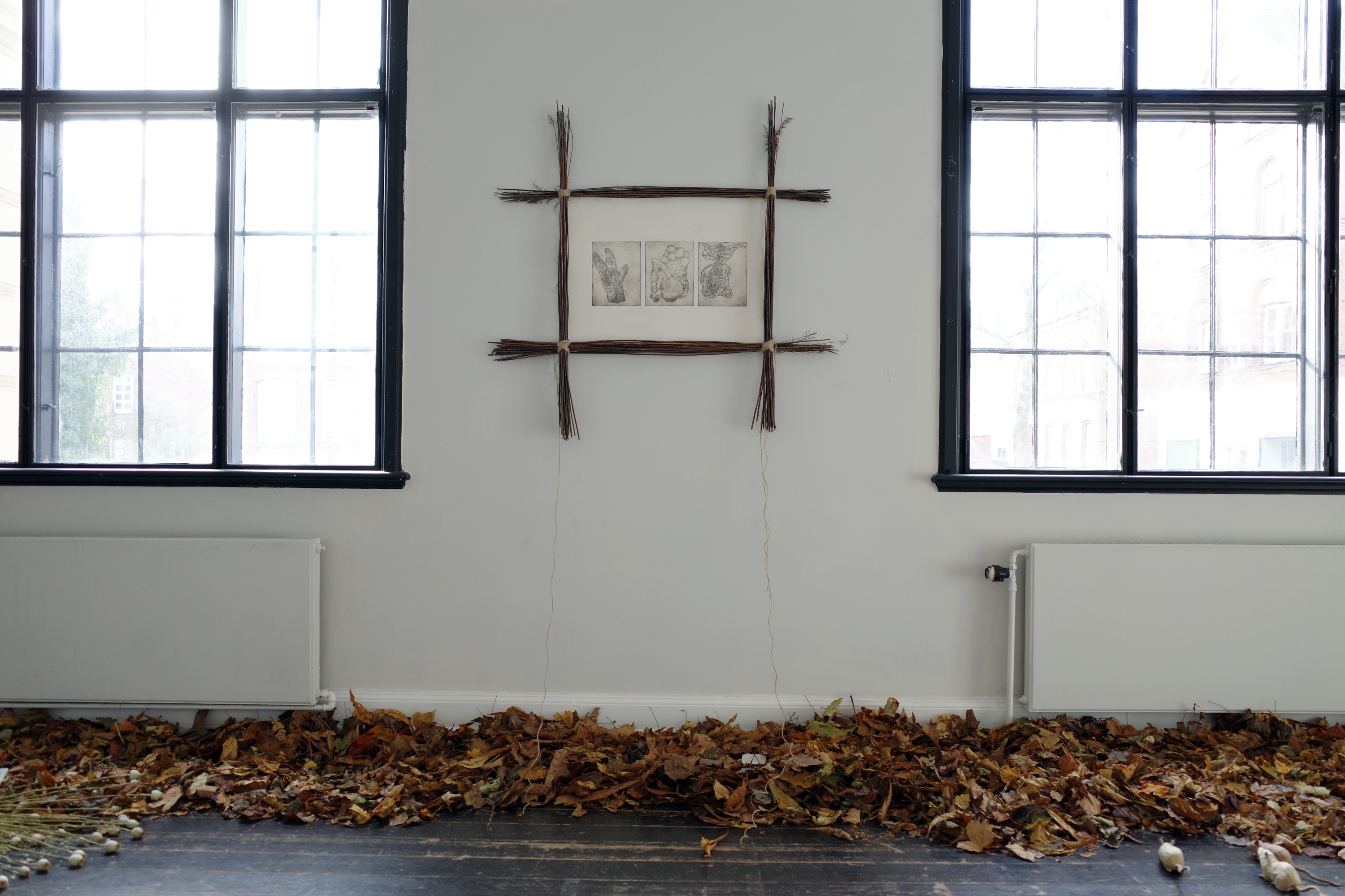 untitled (sigil), 2023, Anders Aarvik. Triptych copper etching on cotton paper sourced from archive of deceased artist, filtered soil and water-based ink, plotting with GraphGear 1000 mechanical pencil, dried branches, jute twine