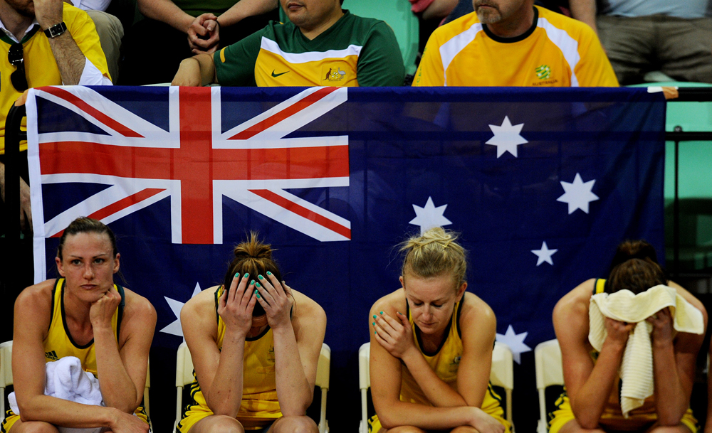 The Australian team are devestated after their loss to New Zealand in the Women's Netball Final at Thyagaraj Sports Complex during the XIX Commonwealth Games in Delhi, India 2010