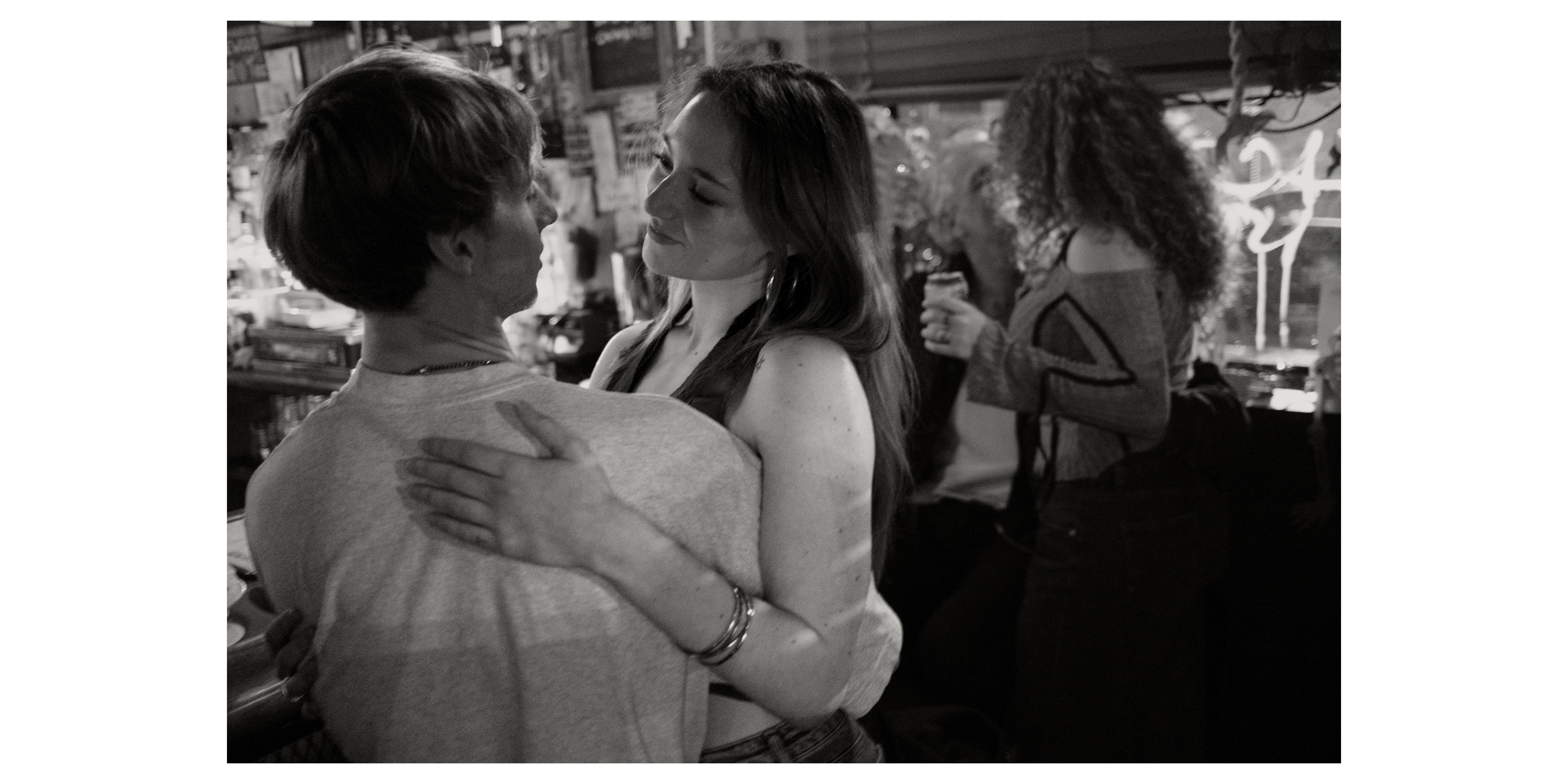 Embracing at the bar, Bushwick, NY, 2024