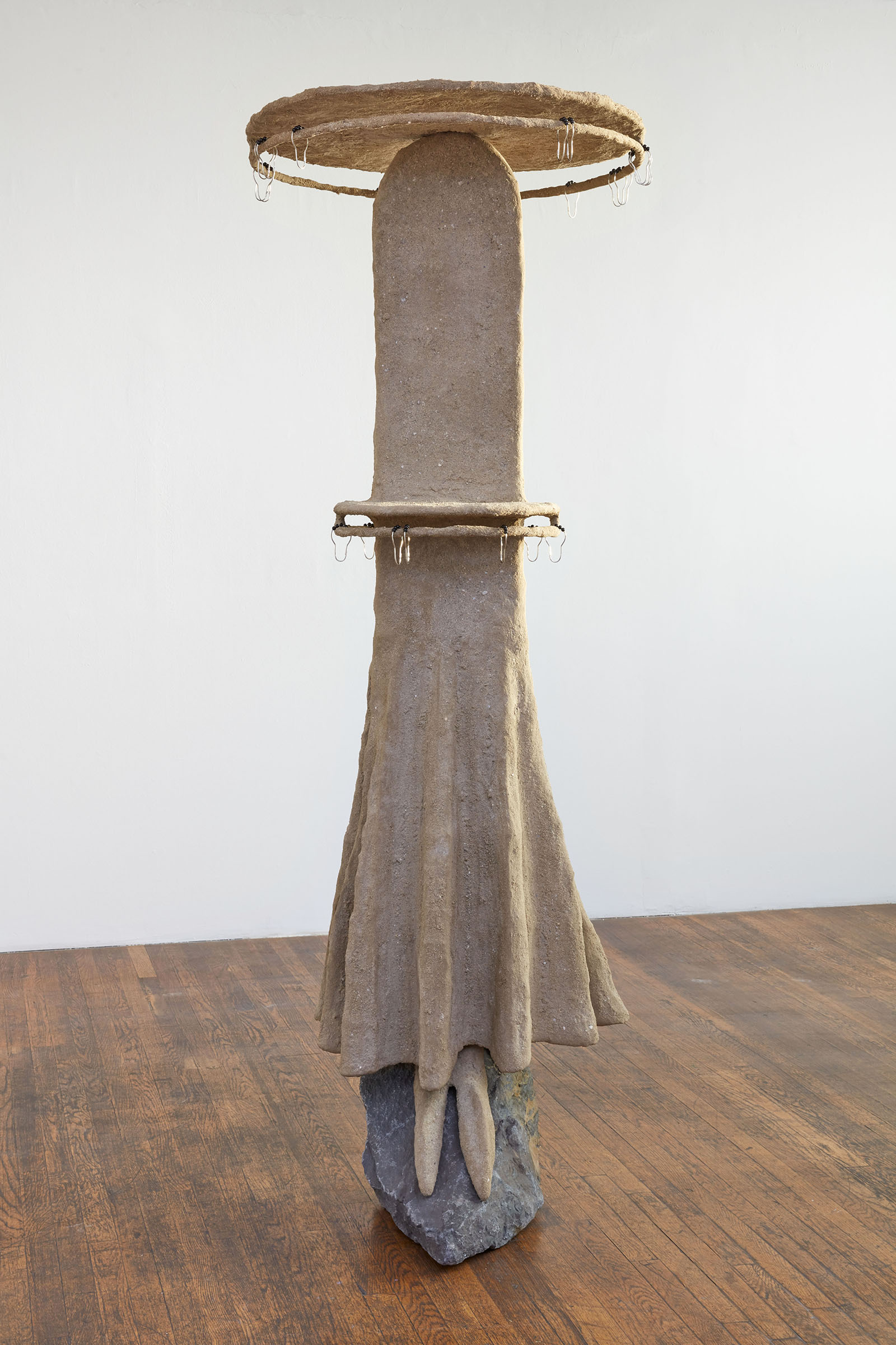 The Mourner, 2021, Steel, sand, polymer, burlap, rock, shower curtain rings