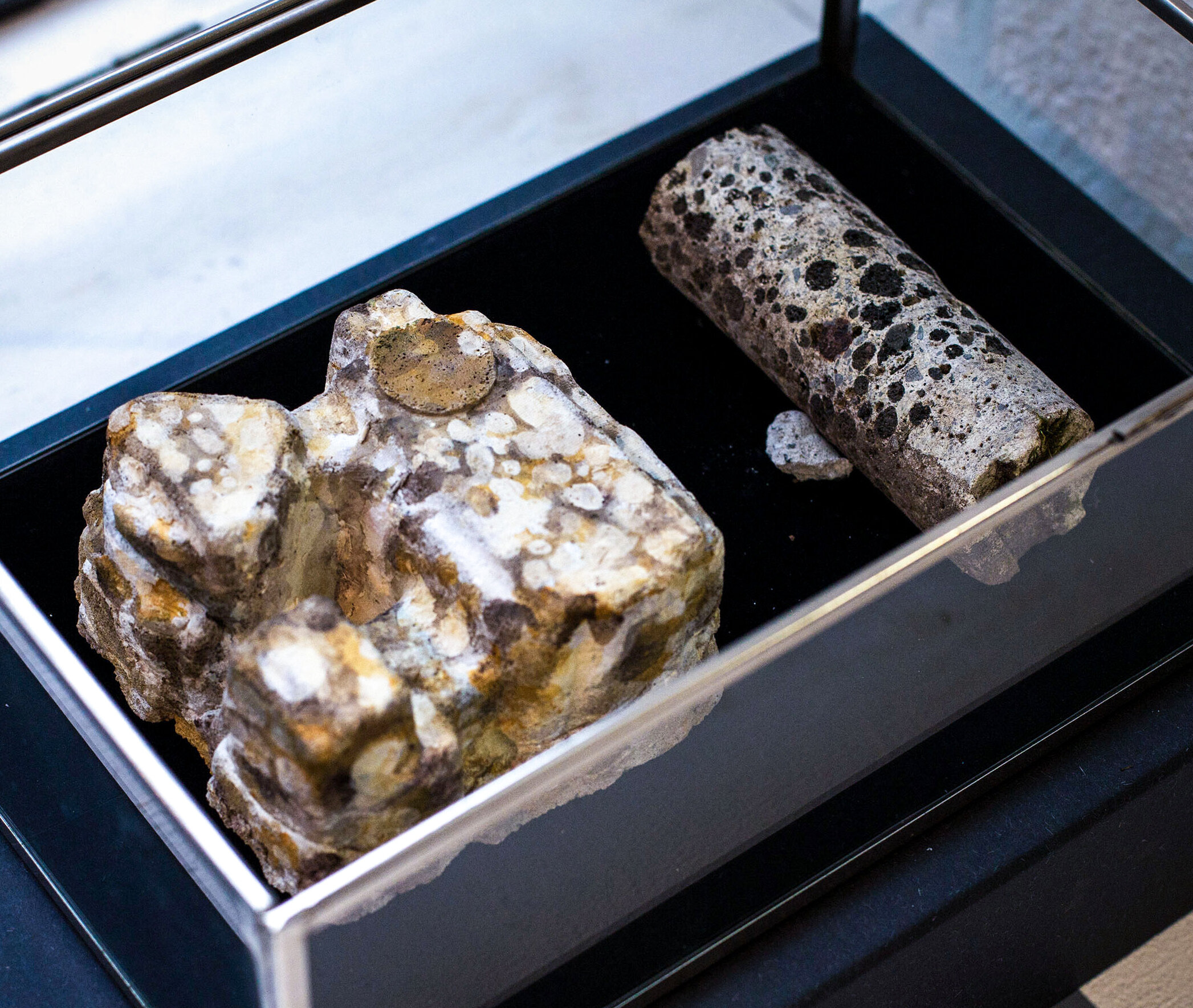 Terrazzo  concrete moulded from recuperated electronics packaging, acrylic paint, glass vitrine, found concrete object, early 21st c. CE.  30 x 20.5 x 10.5 cm  Note: all dates from this long ago should be regarded as either approximate or conjectural; there are no absolutely certain dates, and there are multiple competing reconstructed chronologies, for this time period.