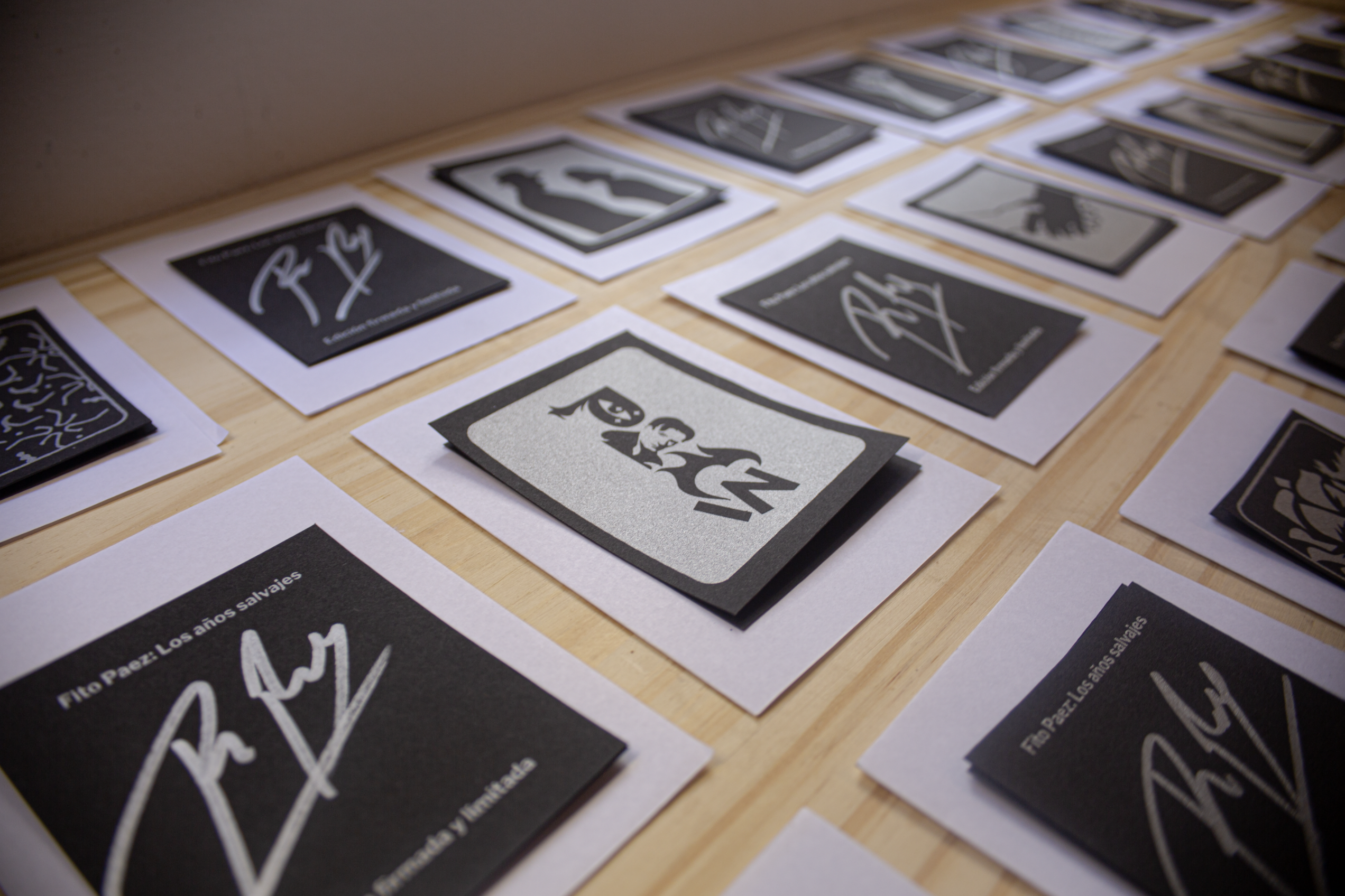 Silver ink screen-printed on black pulp paper