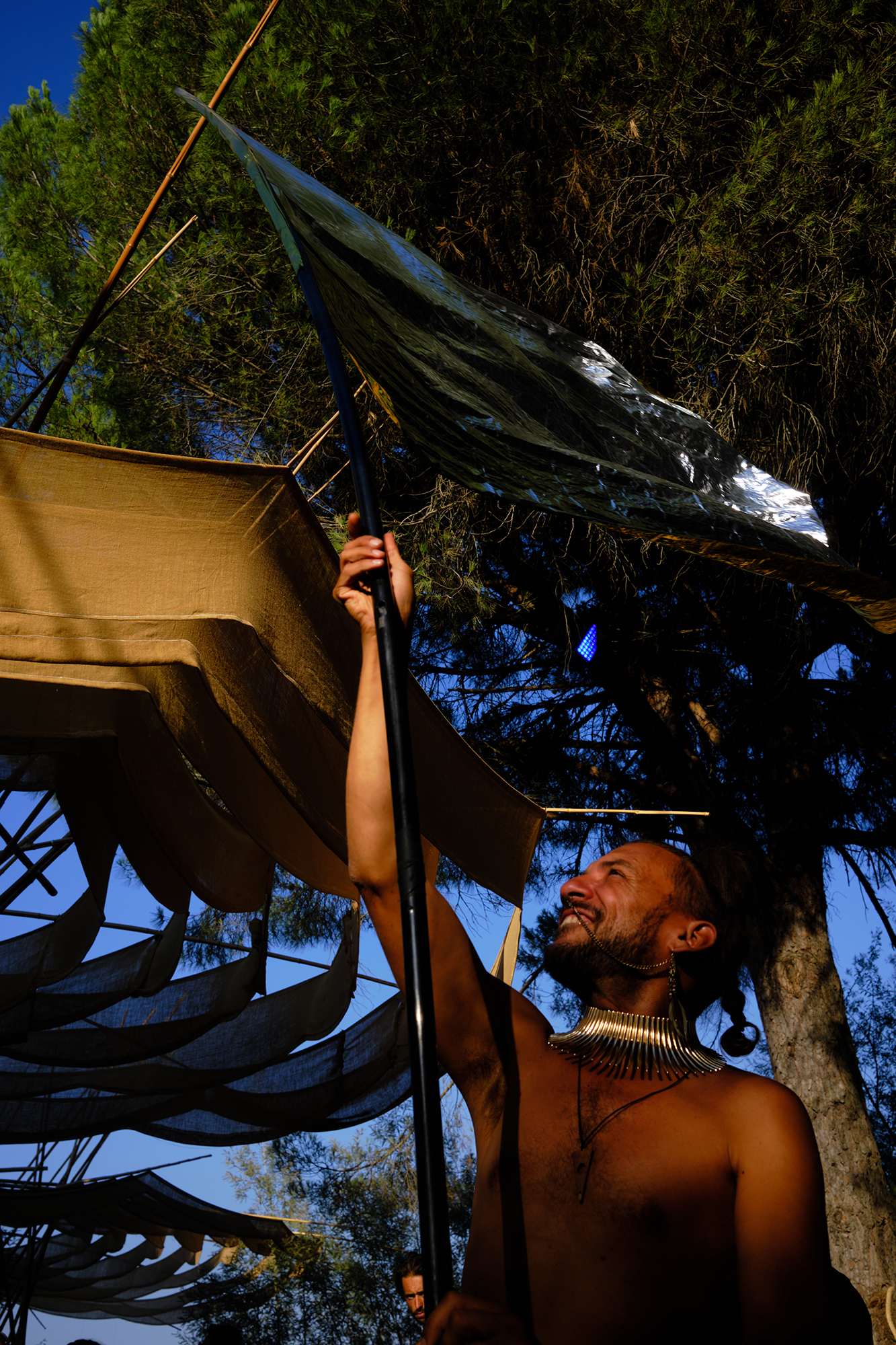 Philippe Sarfati-festival-photography-photographer-street-documentary-waking-life-crato-portugal-man-smiling-flag-silver-waving-joy-structure