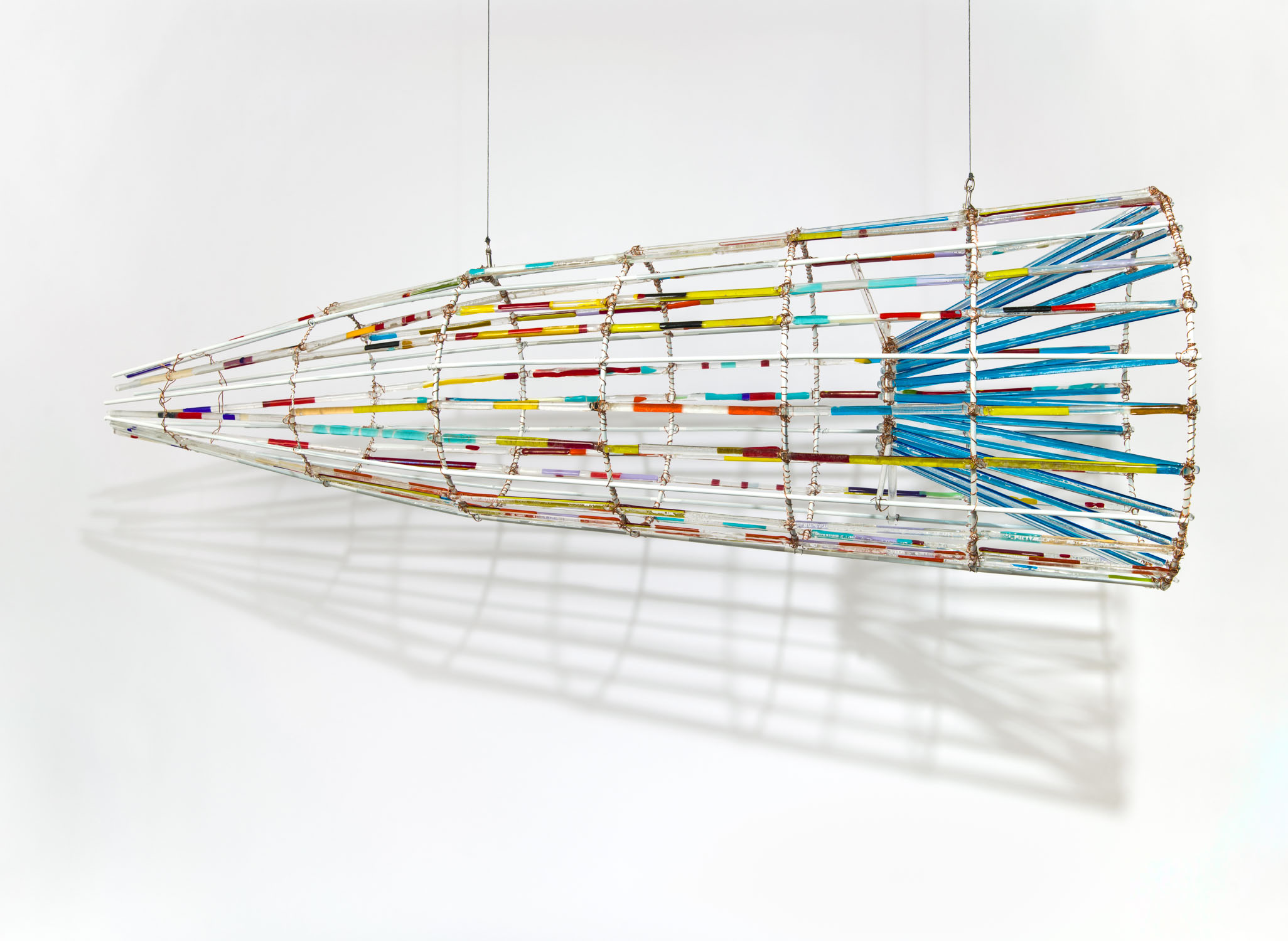Plateau Fish Trap, 2023, Fused glass, copper wire and aluminum rod, 24 x 72 x 24 in.