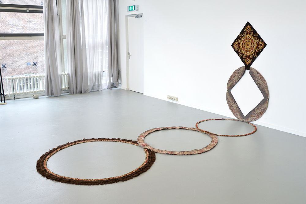The Origin of the Circle, 2015. Sculpture, sectioned rug, 1.5 x 150 x 190 (wall section) and 1.5 x 150 x 360 (floor section)