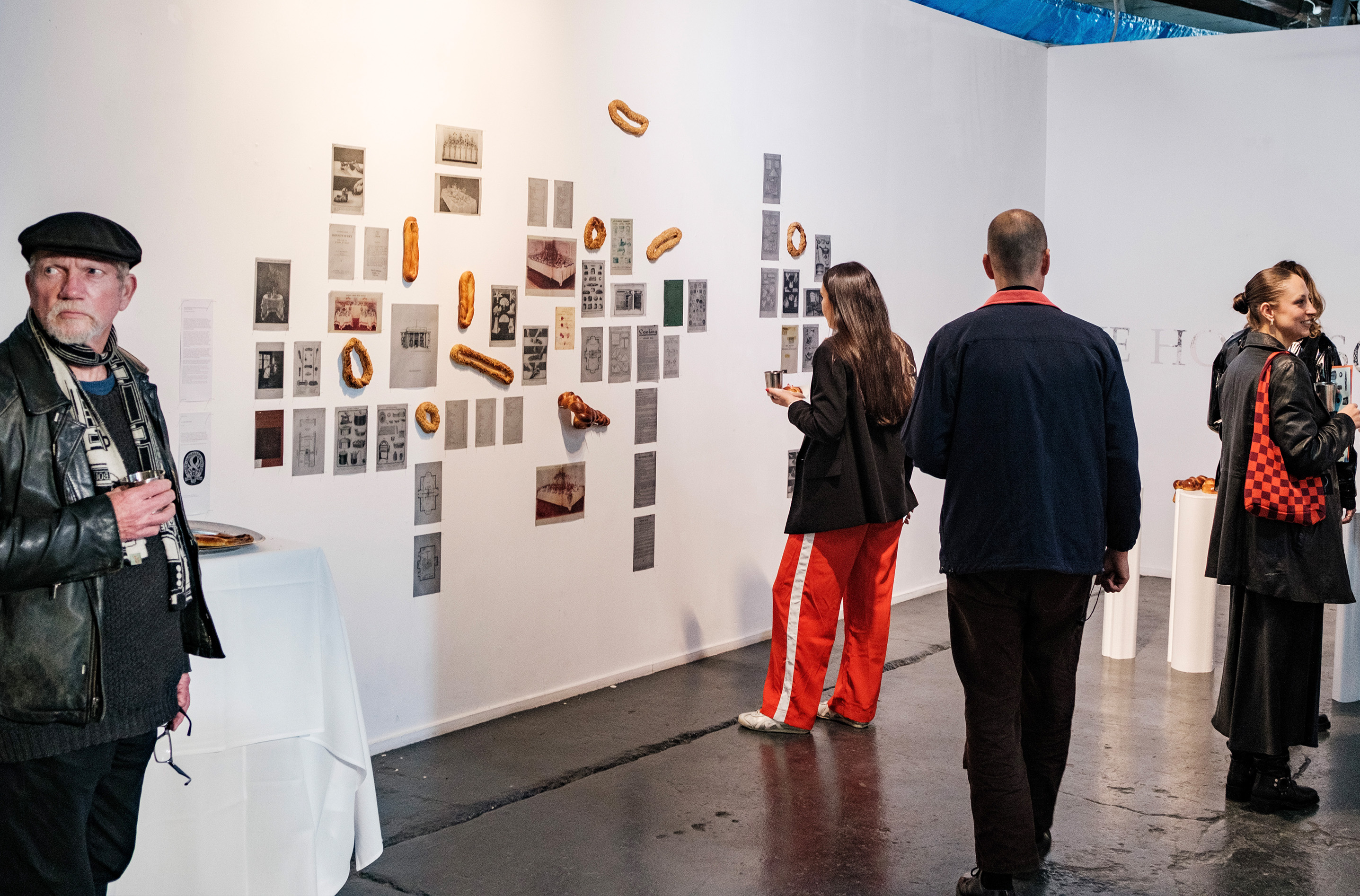 Archival reproductions on trace paper, silver pins, nails, bread. Photograph by Temitope Adesina