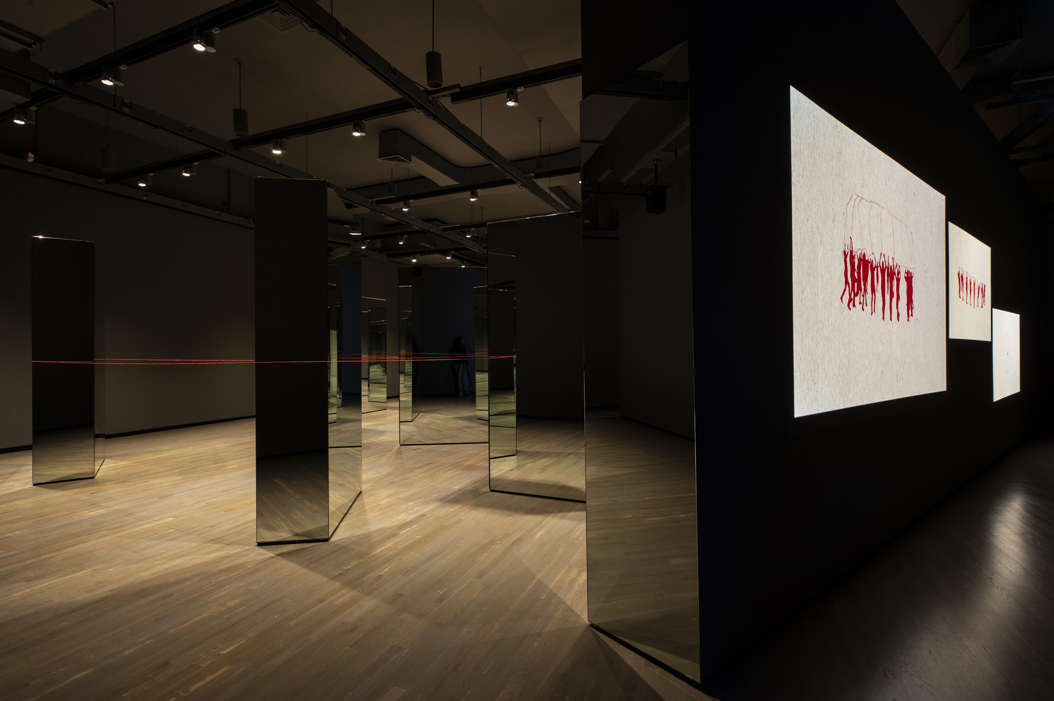 Installation view (left to right): Carmen Papalia, Red String (2015 ongoing), courtesy the artist; Carmen Papalia and Heather Kai Smith, Open Access: Claiming Visibility (2019), courtesy the artists. Walter Phillips Gallery, Banff Centre for Arts and Creativity. Photo by: Jessica Wittman.