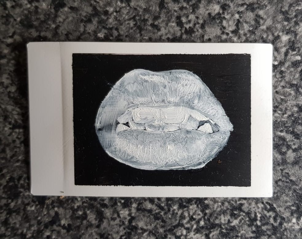 1/3, 2020. one of a three part set of polaroid paintings that phonetically  spell out 'teeth'. originally painted blue, a chemical reaction with the polaroid base drained all the colour from it.