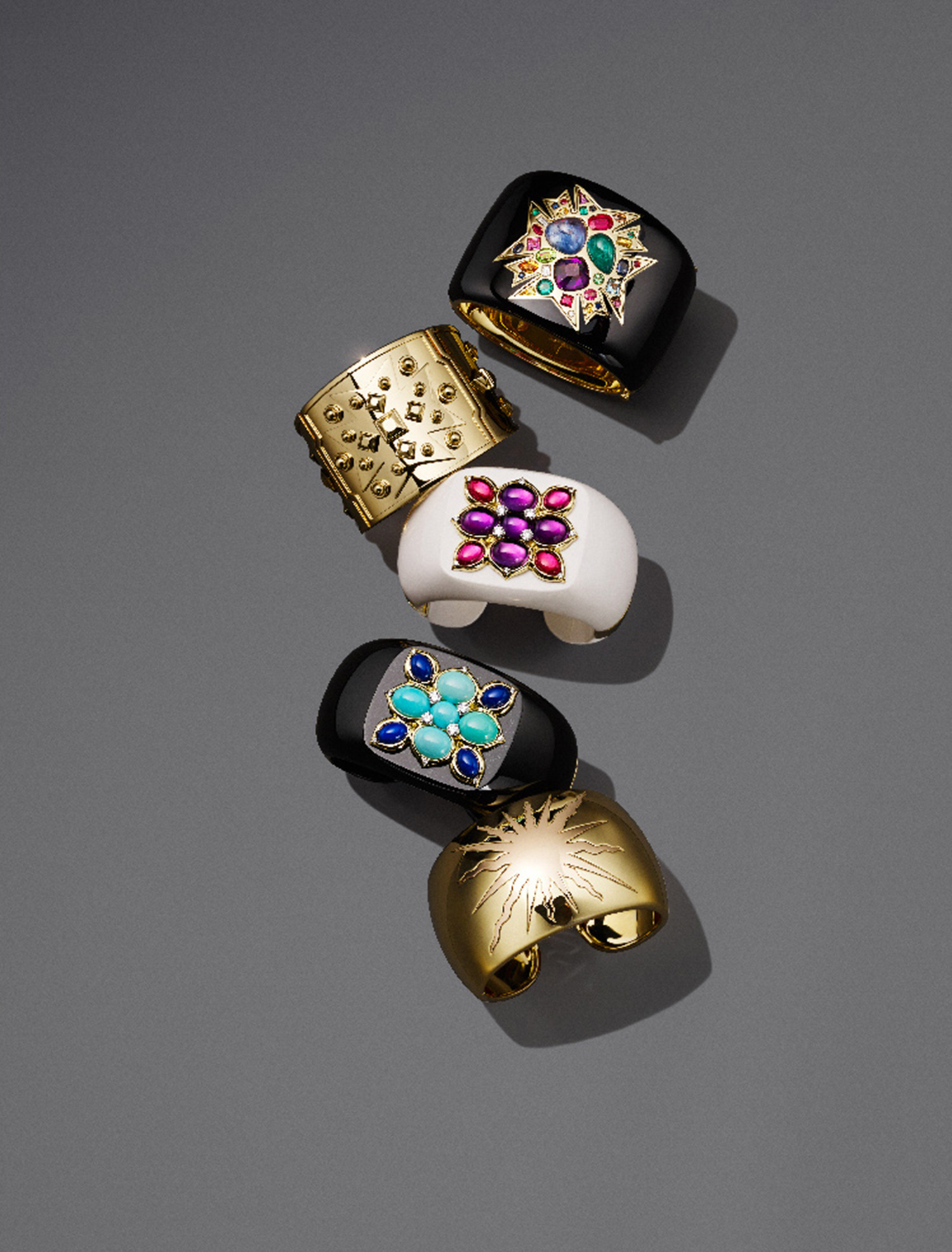 KMA stylist Sara Wacksman designs set for a photo of bright colorful rings on a gray background for Bergdorf Goodman