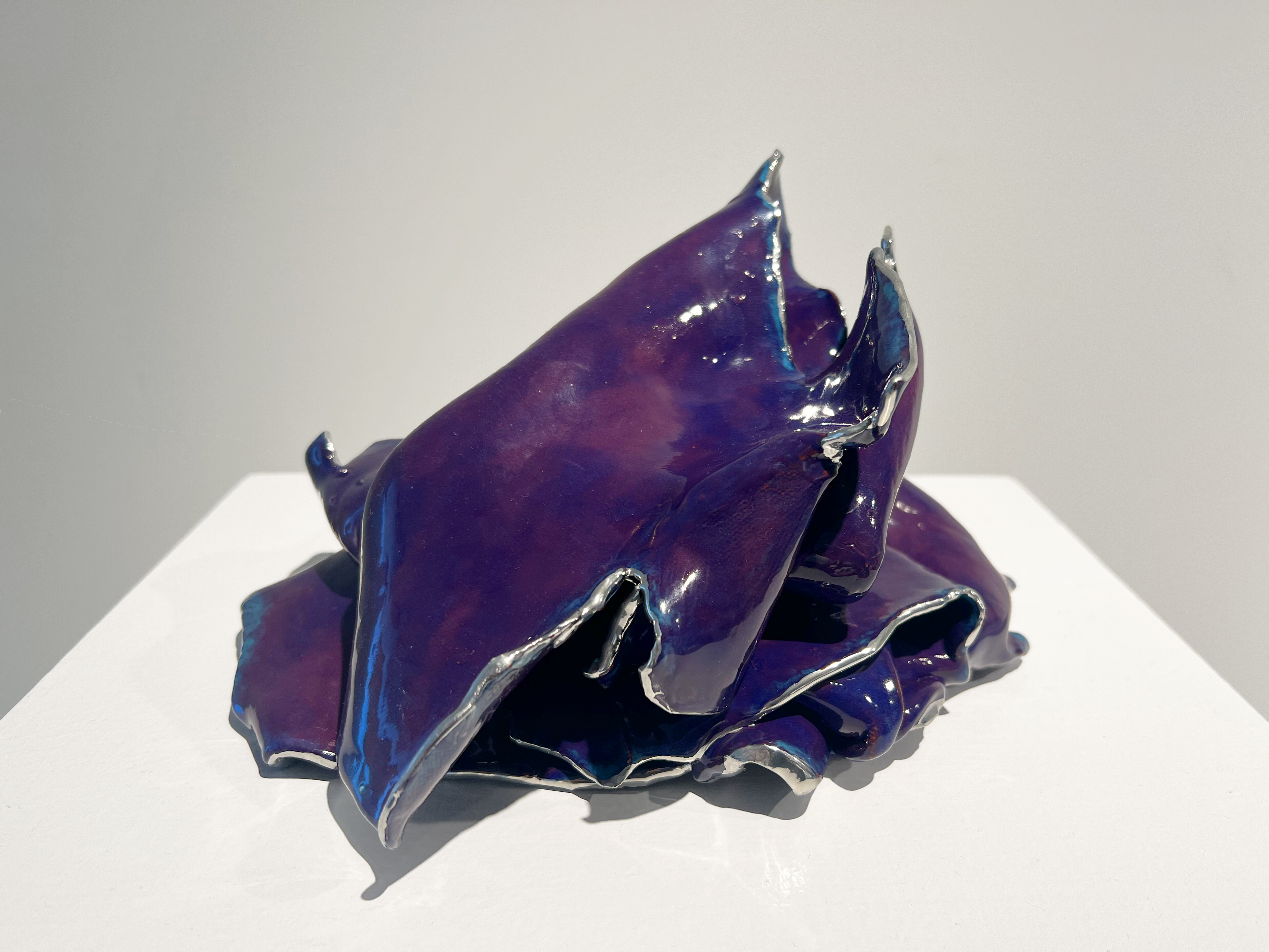 Folds #2. 2022. 10 x 8 x 8 inches. Earthenware, underglaze, glaze, chrome paint. 