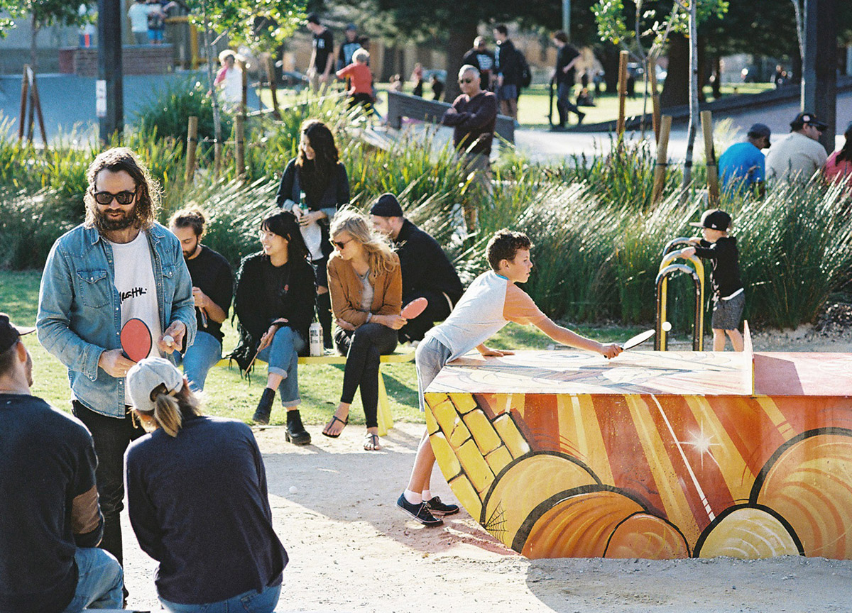 people playing outdoor table tennis on some popp tables in Fremantle, Western Australia