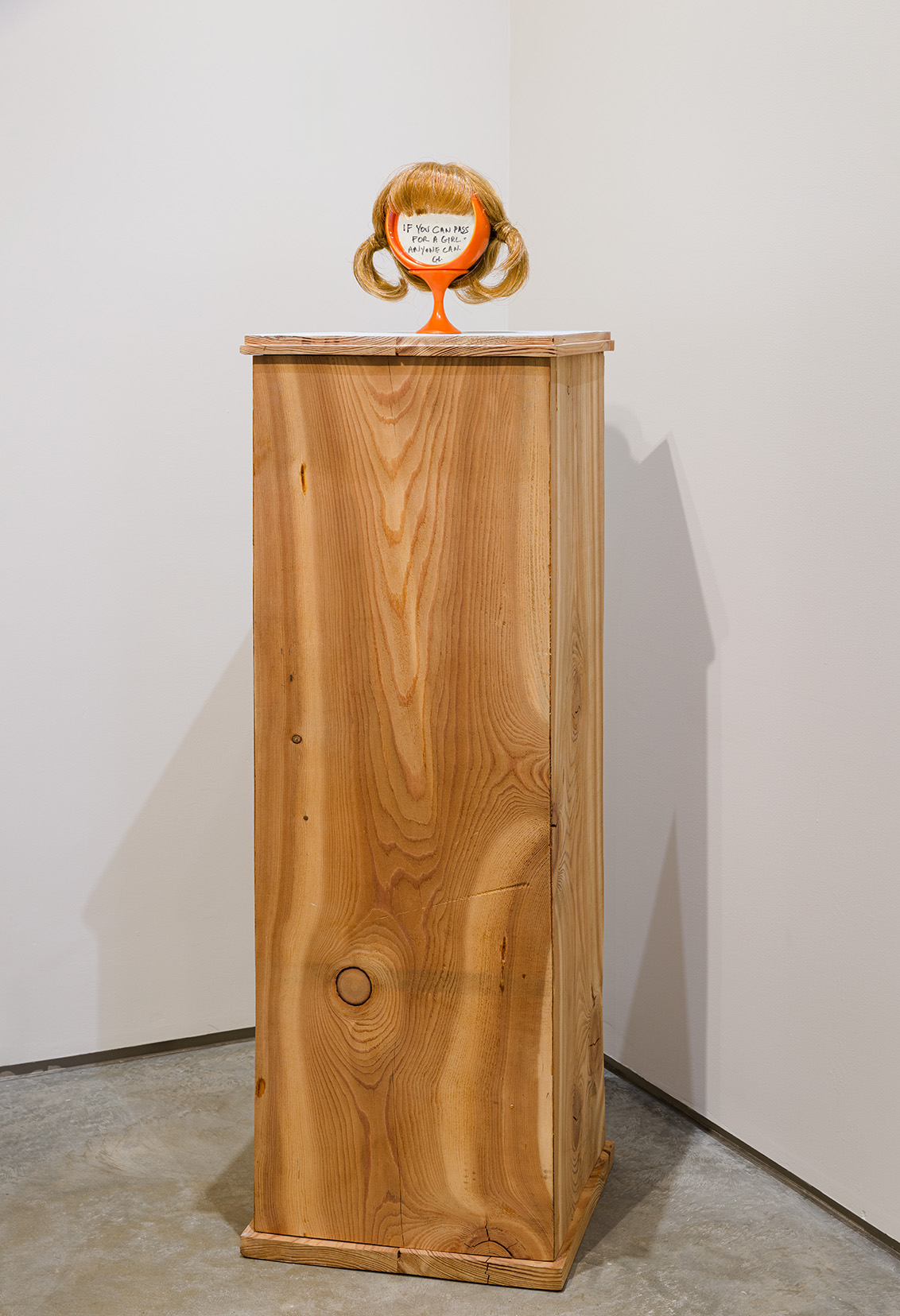 Greer Lankton, If you can pass for a girl, 1989. Wig, mirror, black marker, 10 x 7 x 6 inches. Photo by Etienne Frossard.