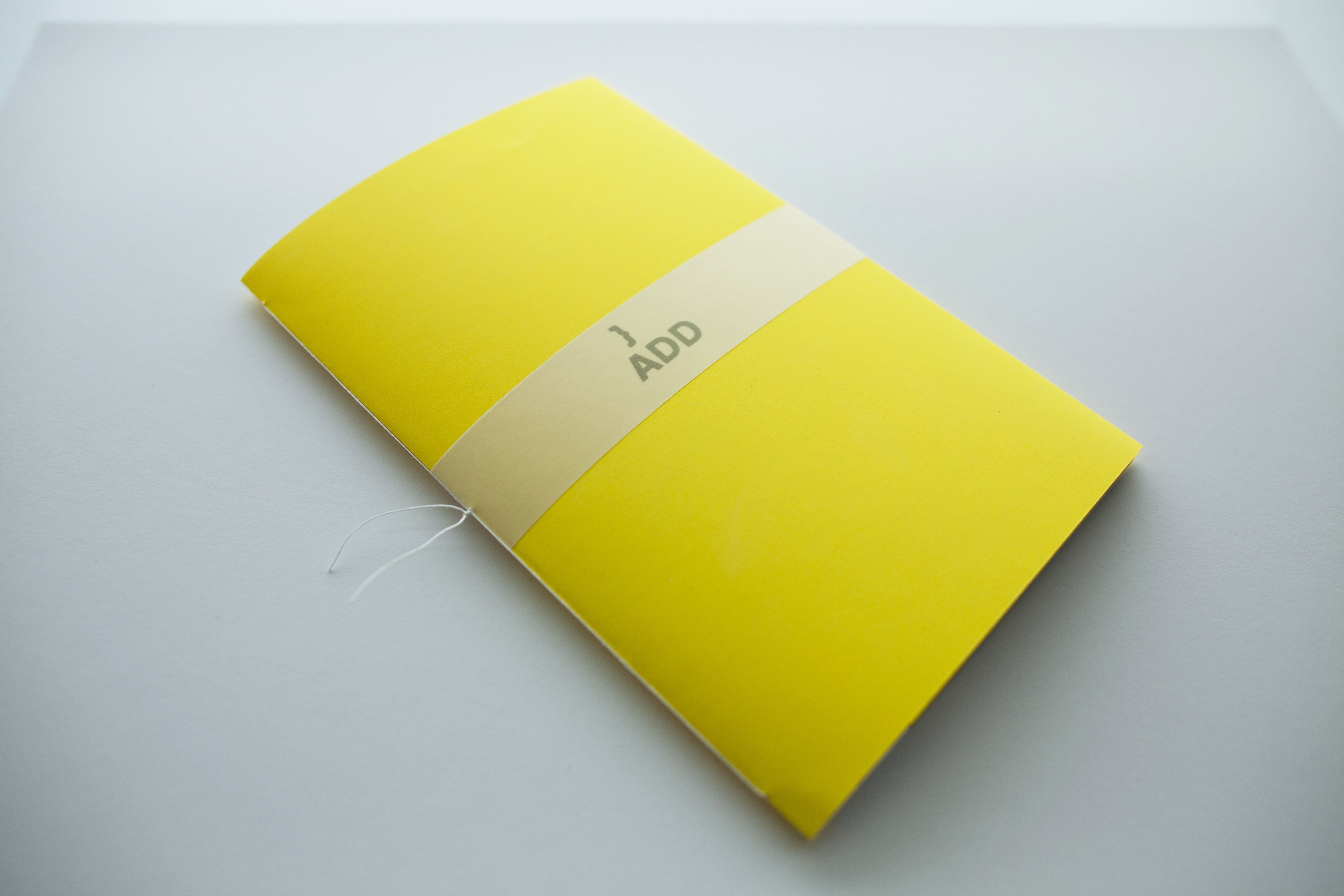 ADDLAB capabilities brochure cover. The brochure was designed so the client could print it at their offices. It is standard A4 size, folded in half, sewn binding, and the cover is one of the brand posters cut to size. This provisional solution was appropriate to start with, as their capabilities were growing rapidly.