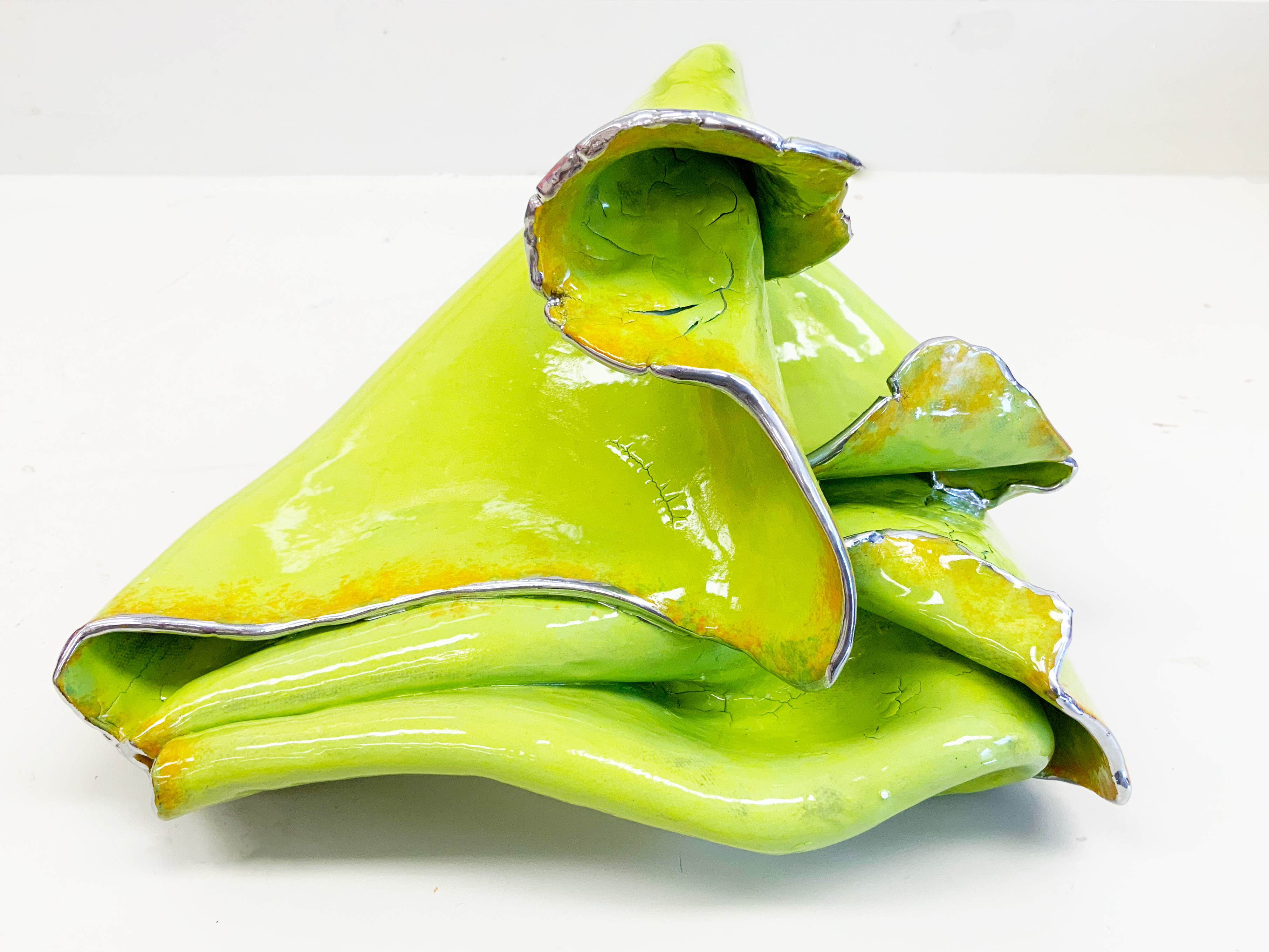 Folds #1. 2022. 11 x 8 x 9 inches. Earthenware, underglaze, glaze, chrome paint. 