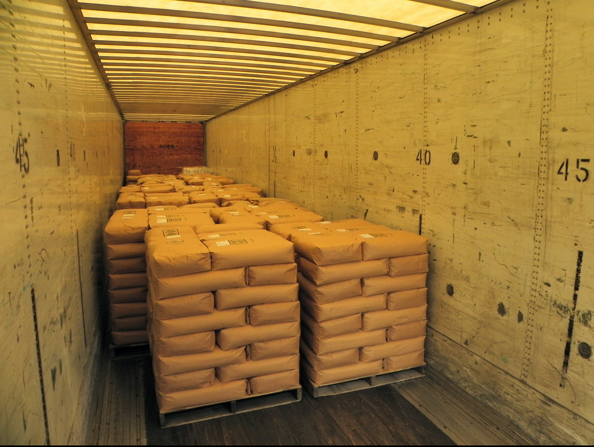 20 tons of flour arrives at a refrigerated warehouse in Chicago.