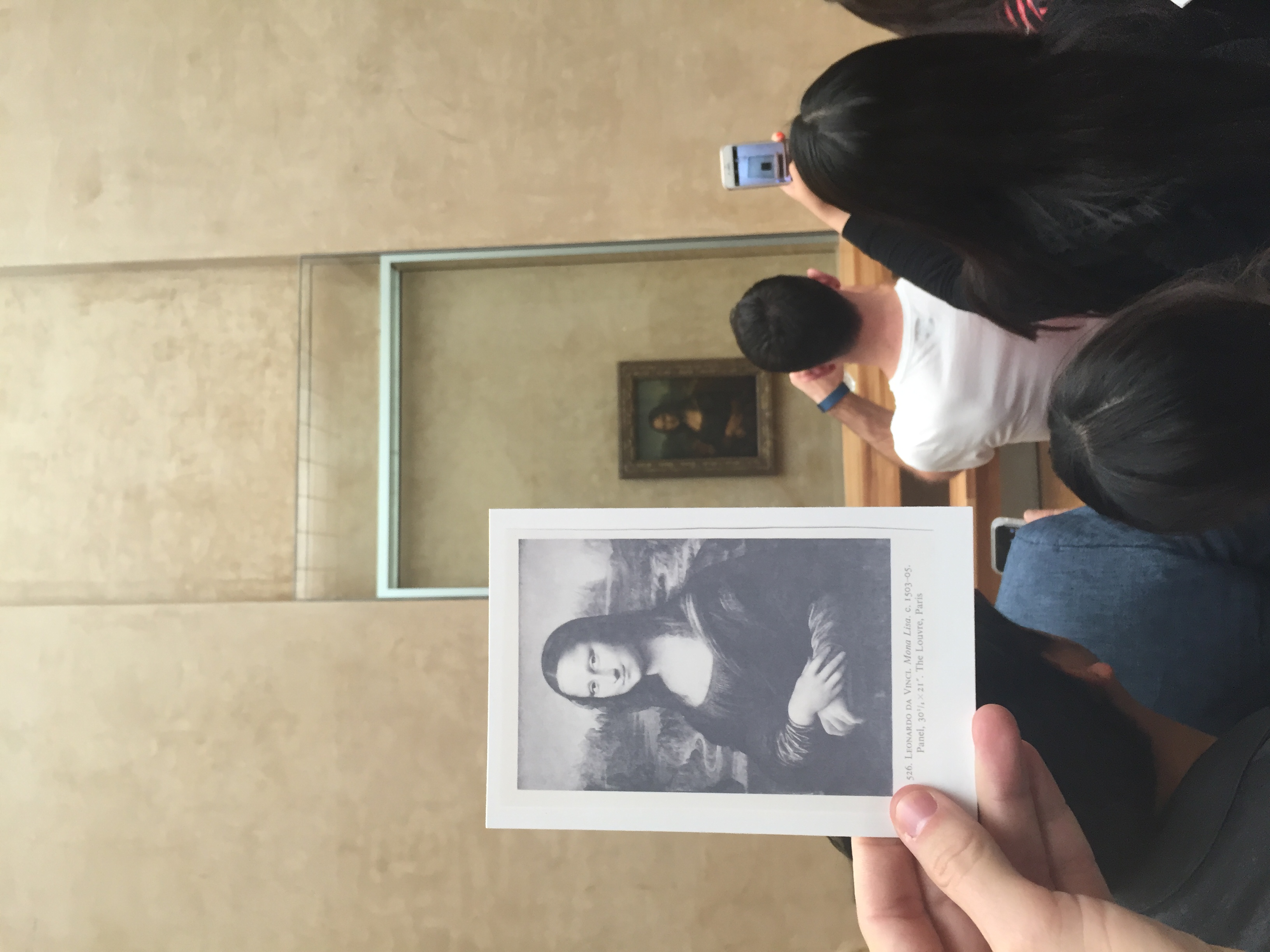 Straight up used the black and white reproduction of the Mona Lisa from an art history textbook from the 1970s for this. Also placed a few of these cards with the Mona Lisa postcards in the Louvre's gift shop. The presence of the original is not a prerequisite. 