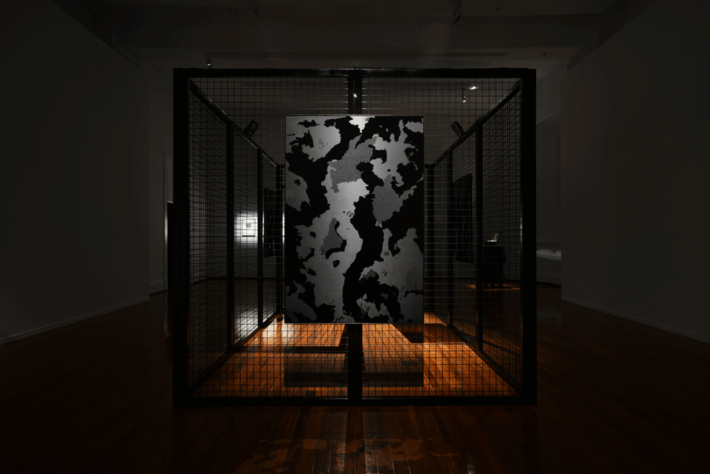 Compound, 2019, Industrial enamel, steel, motion sensors and LED flood lights, 270cm x 390cm x 270cm