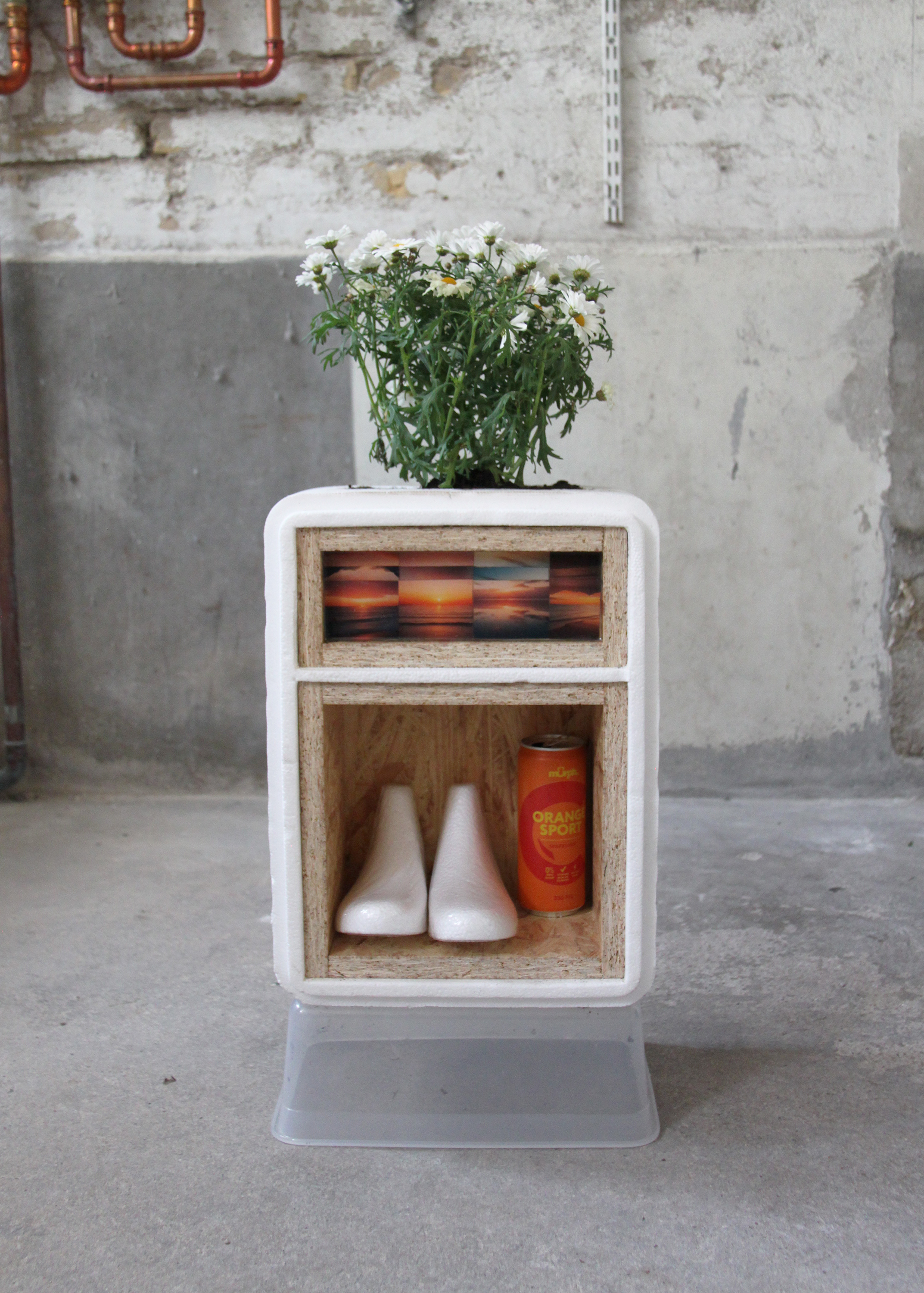 compartment for styrofoam and a planter, 2025, 68cm x 27cm x 17cm, styrofoam, wood, plant, soil, orange soda can, images, resin 
