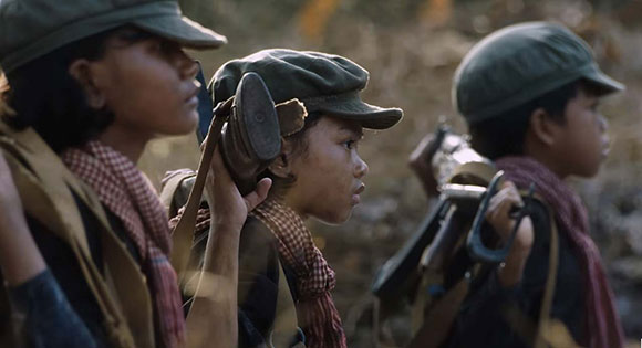 Figure 2. Loung Ung, played by Sreymoch Sareum, militarized as a child soldier in First They Killed My Father (Jolie Pas, 2017).