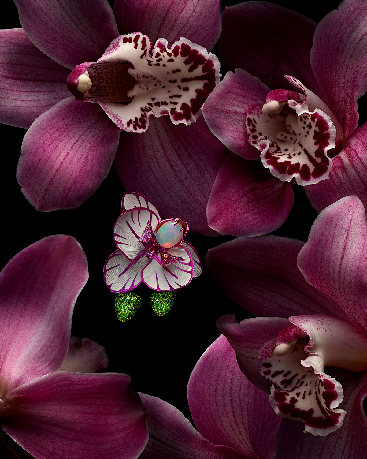 KMA photographer Isabelle Bonjean shoots photograph of earrings for Chopard laying on a bed of purple flowers