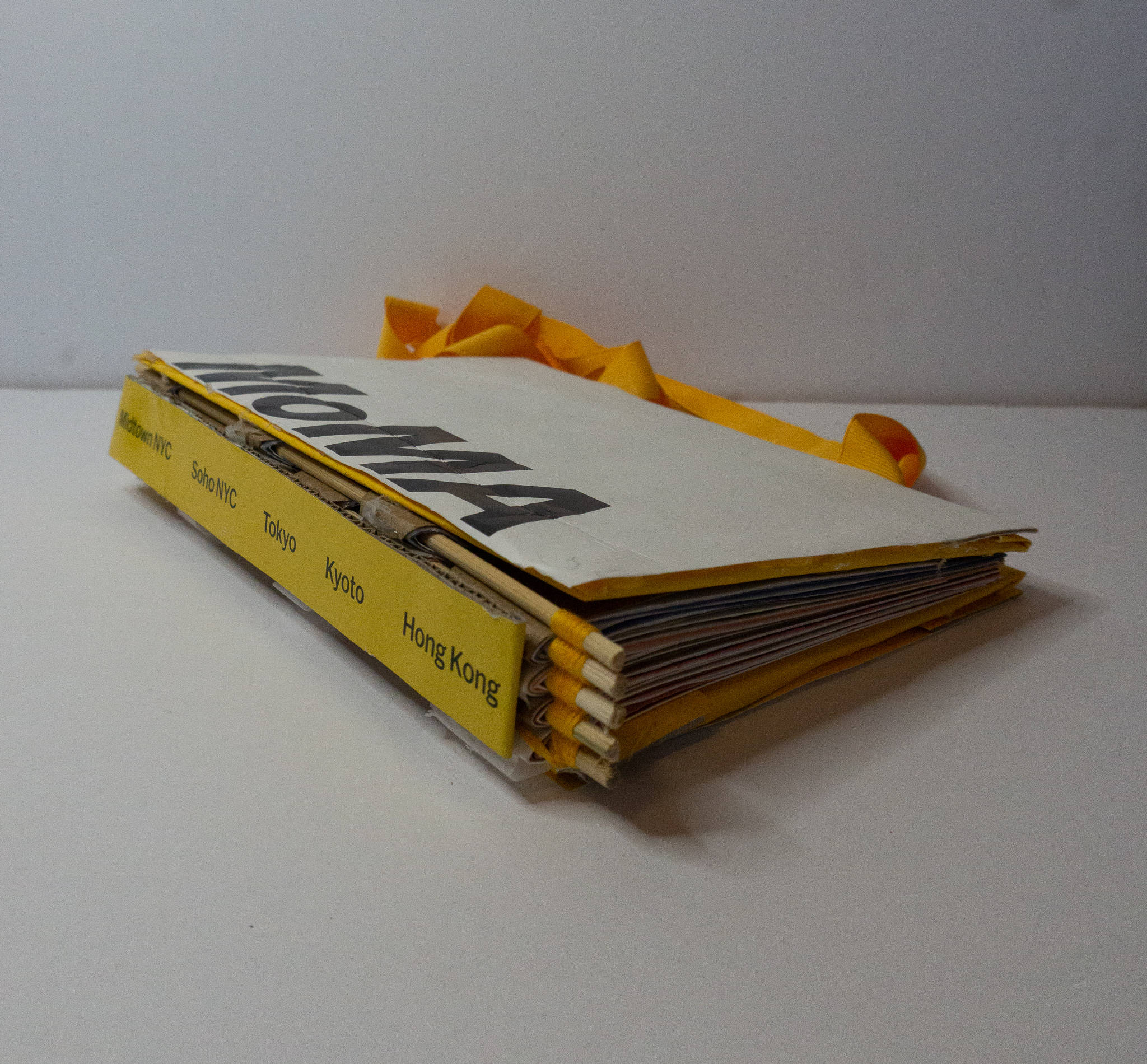 Moma To-Go, 2021, Recycled Materials, Thread, Wooden Dowels, Various Papers