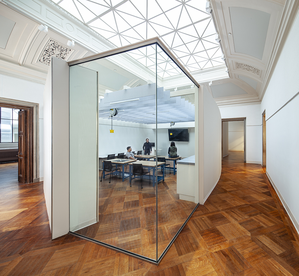 Classrooms were treated as “objects” within a larger gallery space, centrally located with acoustically buffered walls and surrounding egress