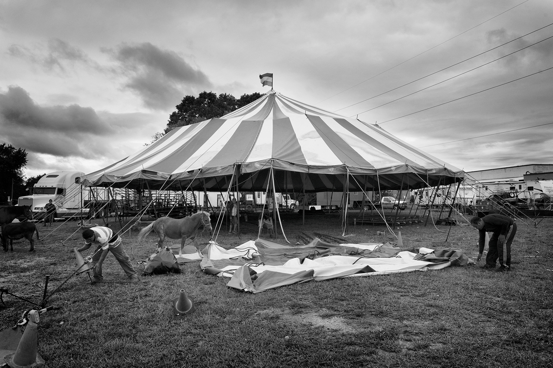 Workers pack up the tent after the show –the circus moves to the next destination.