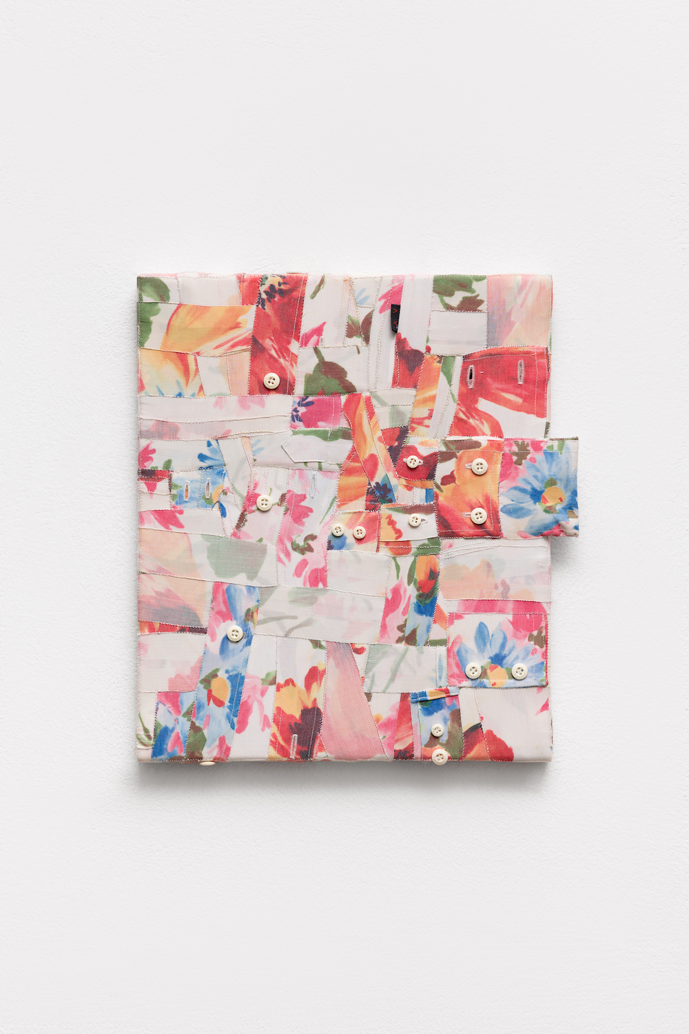 ’Célio’, 2025. Deconstructed men’s shirts hand stitched over wooden stretchers. 35 x  30 cm