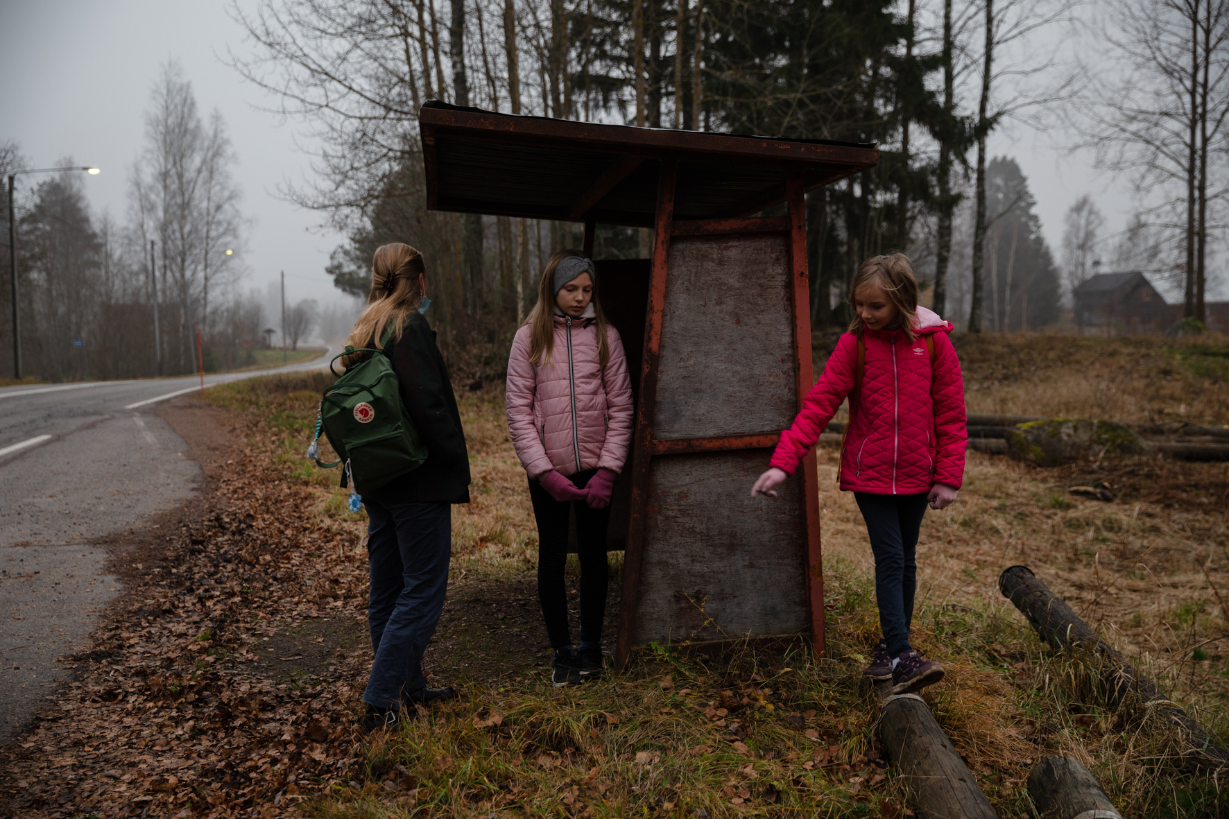 Waiting for a school bus to arrive. (2021)