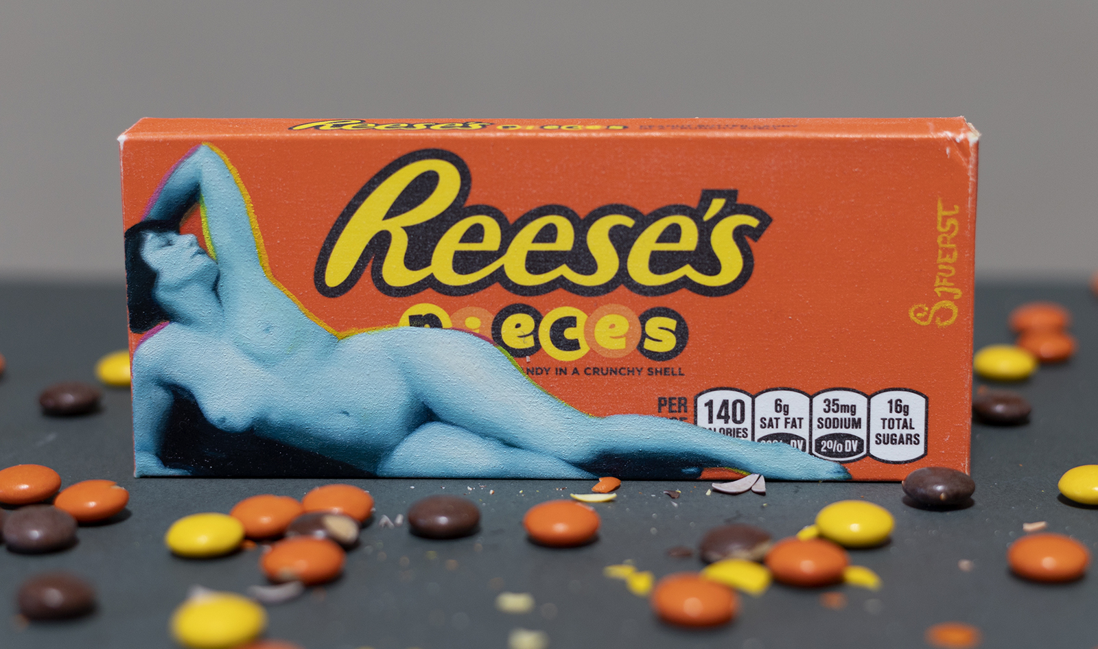 'Reese's Pieces'. Oil paint on primed candy box. 15.5 x 6.5 cm