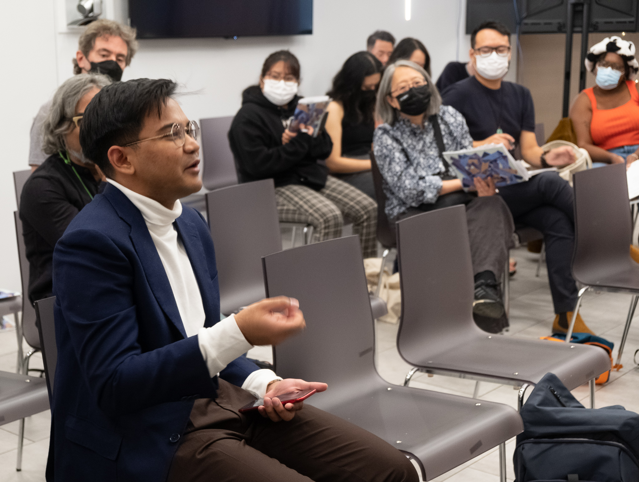 Attendee asks a question at Diasporic Poetics panel. New York University, NYC 2022.