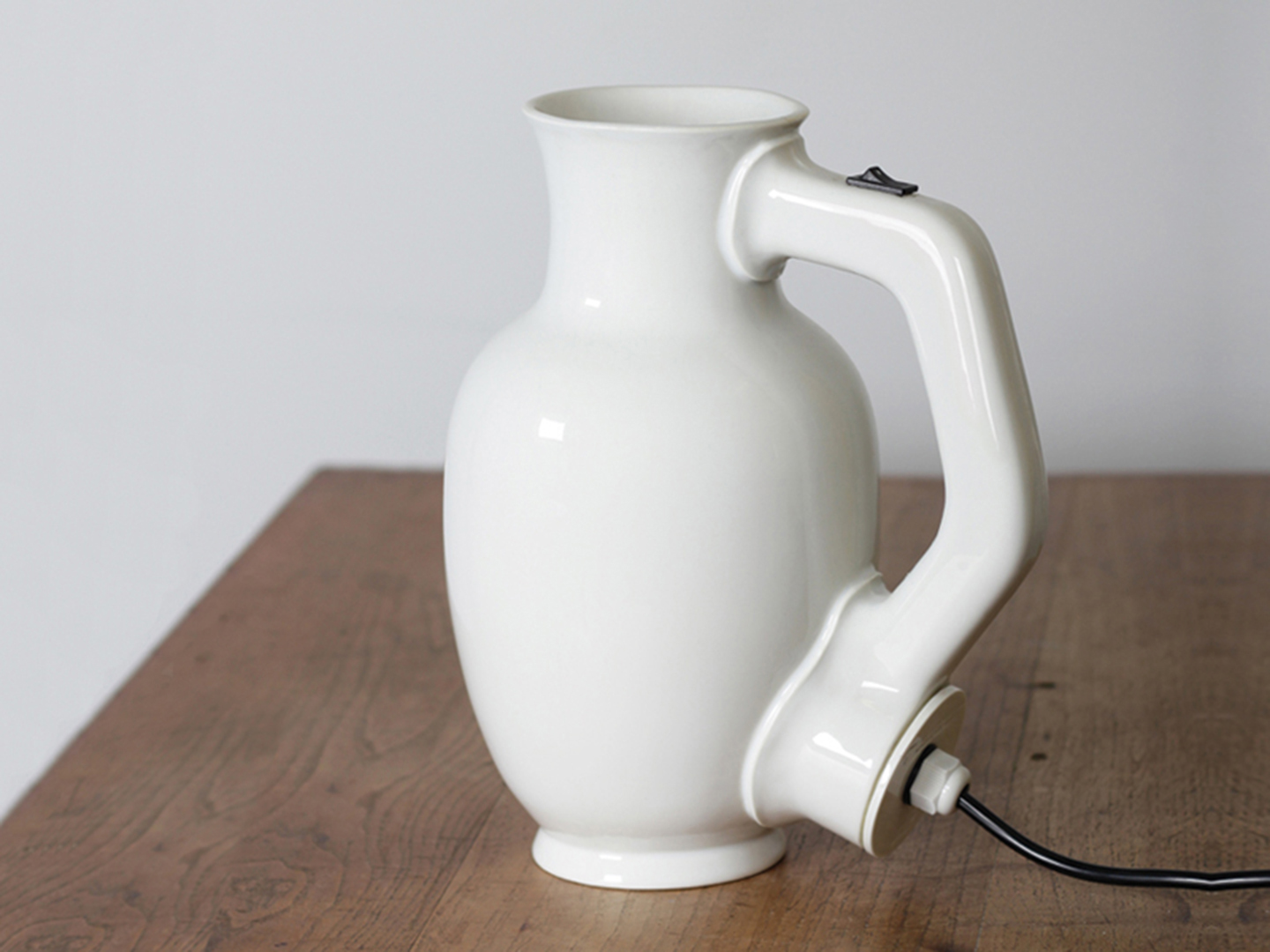 KettlePorcelain is the most obvious choice for an electrical kettle, it stands heat, doesn't conduct electricity, is extremely durable, very easy to clean and super beautiful!