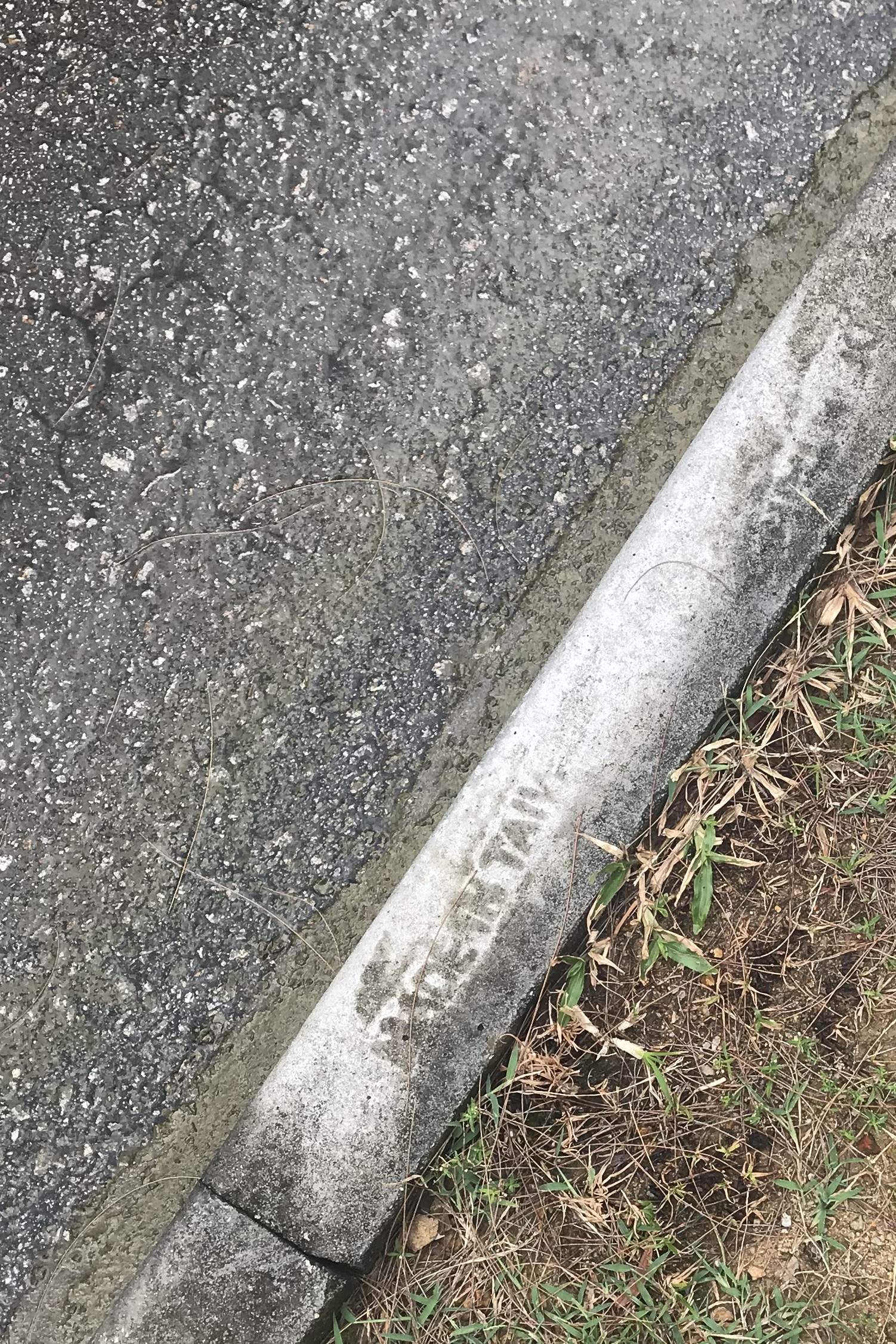Sandals on sidewalk. Lamma island, Hong Kong. September, 2019
