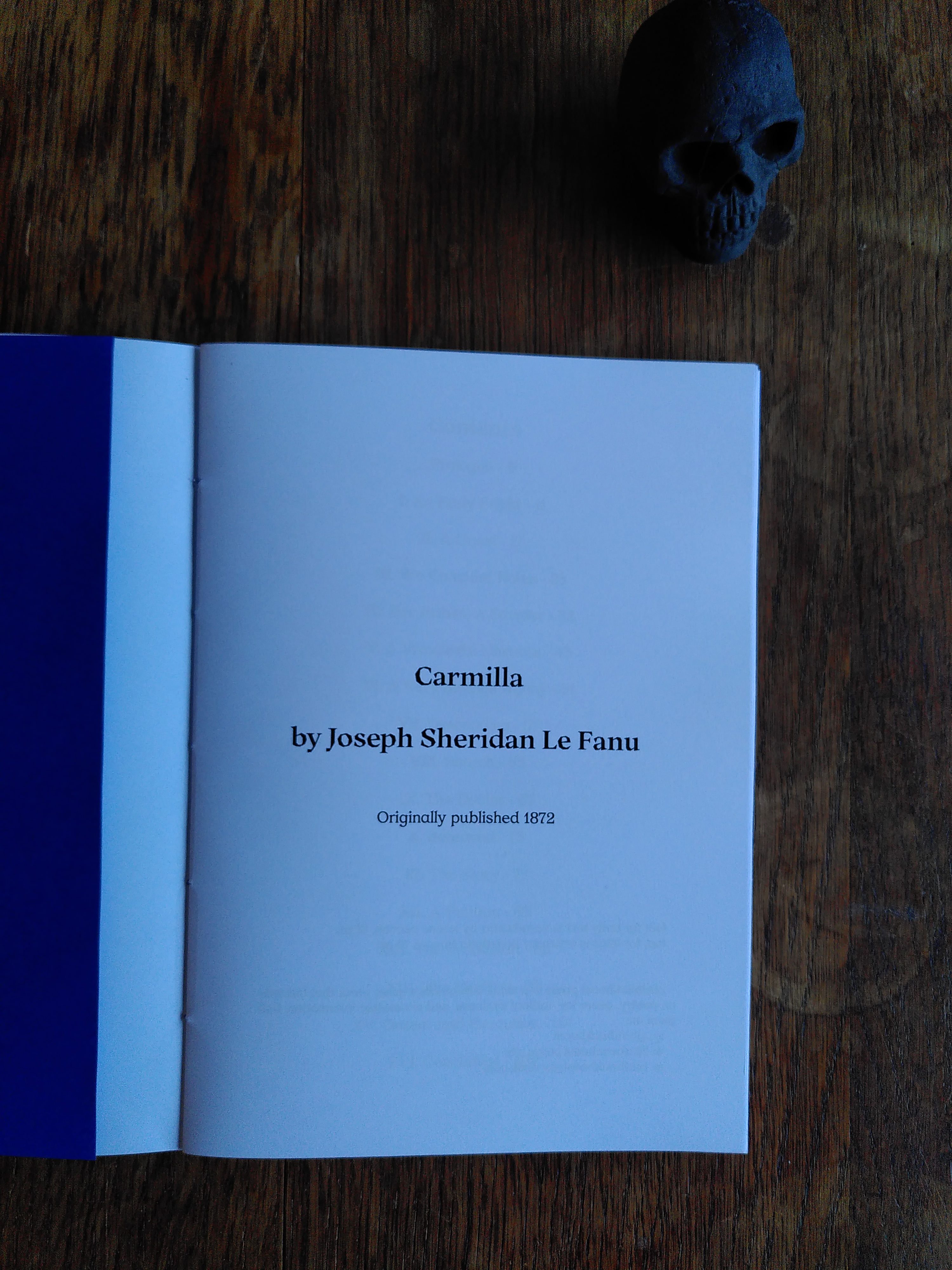 carmilla by joseph sheridan lefanu is an A5 booklet with white pages and a deepblue cover. it has deep blue link-stitch binding.