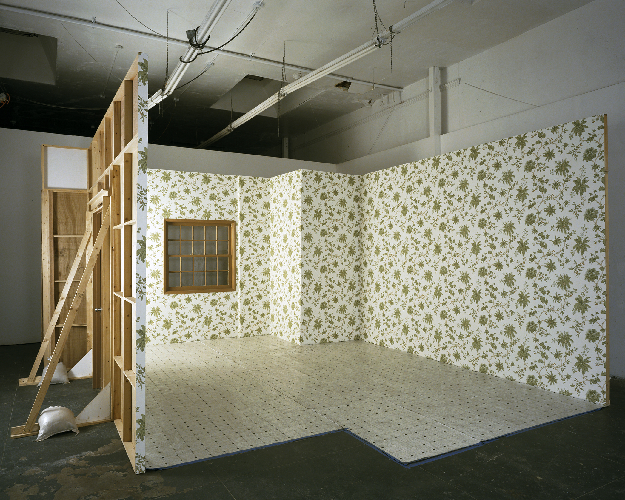 Phantom Limb, film set: wood, linoleum, and wallpaper with window and door elements