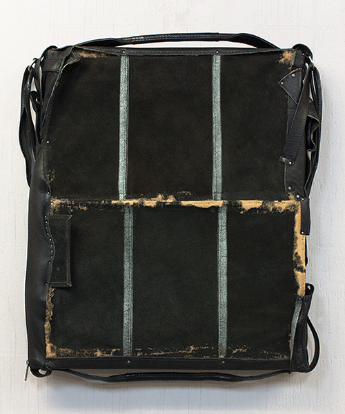 Some Quietness of a Thunder, 2013 / leather messenger bag, metal / 22 in x 18 in x 2.5 in
