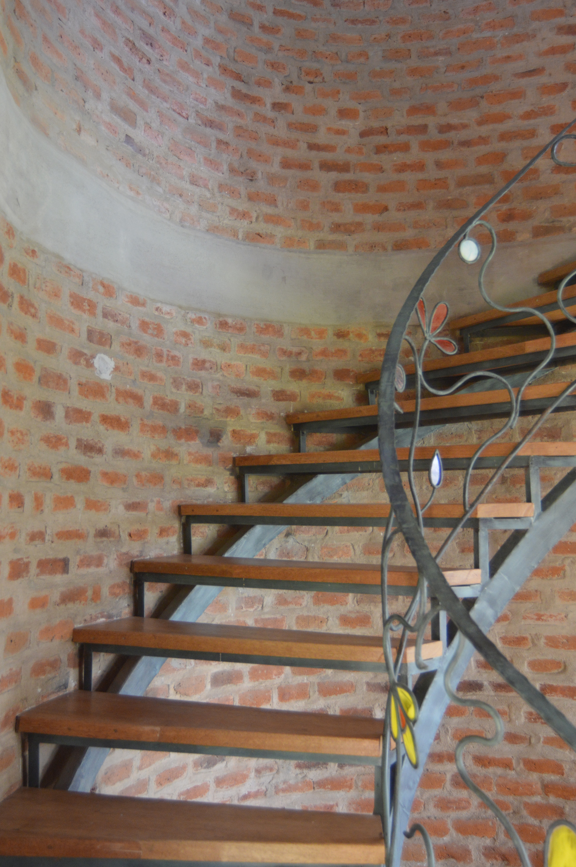 The owner of this house is a filmmaker who has lived in different countries through her carreer and studies. She was looking for&nbsp; her settle down home and came to me with a drawing, that for her represented:&nbsp; her life journey. A house that inclueded features and materials of all the places where she has lived. This design is the reinterpretention of her vision, where the massive (organic-shapped) brick wall is the strongest influence that shapes facades, innerspaces and underline the views.